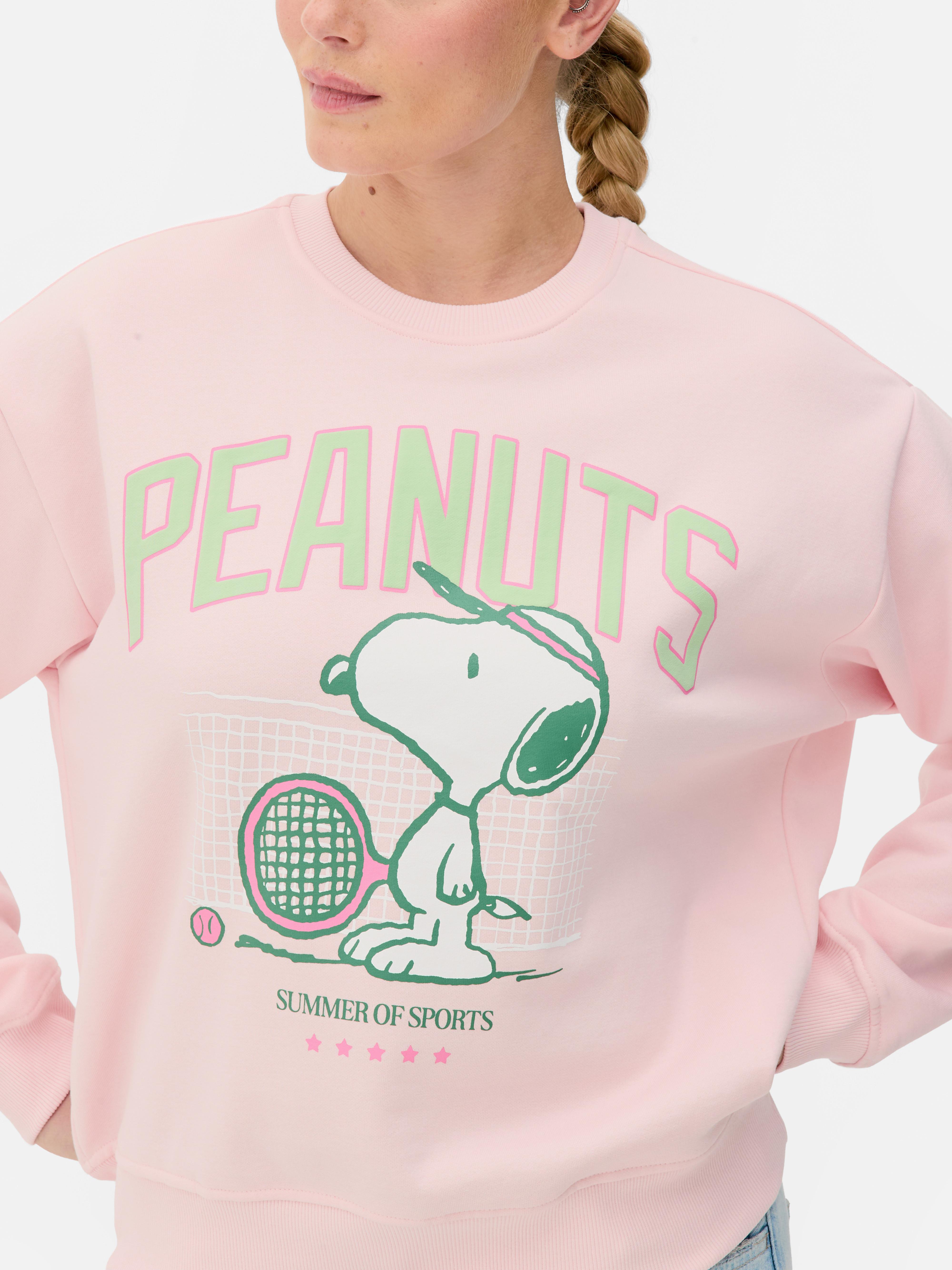 Sudadera de Snoopy jugando al tenis