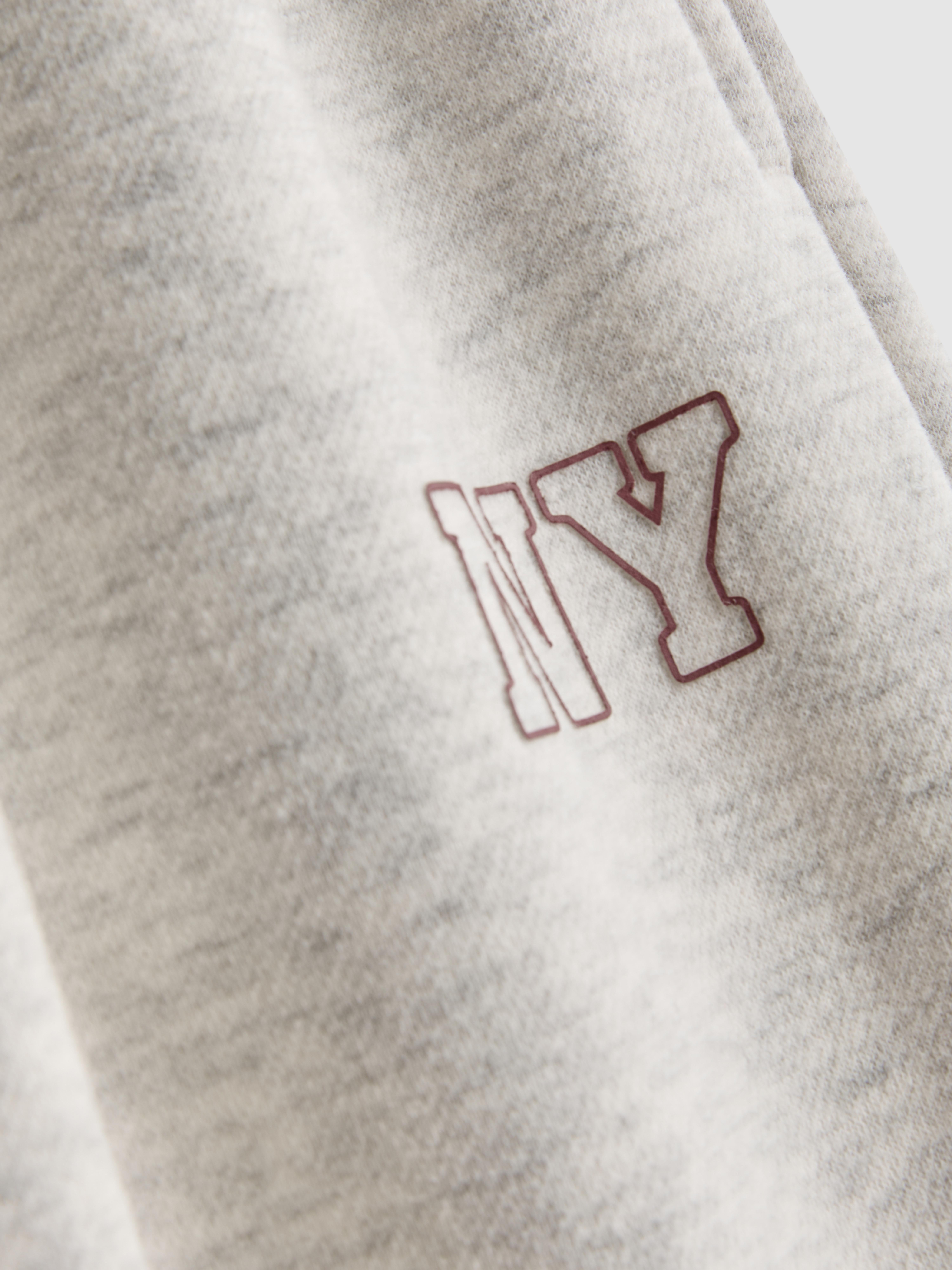 7-15 anos | Calças treino corte barrel gráfico New York