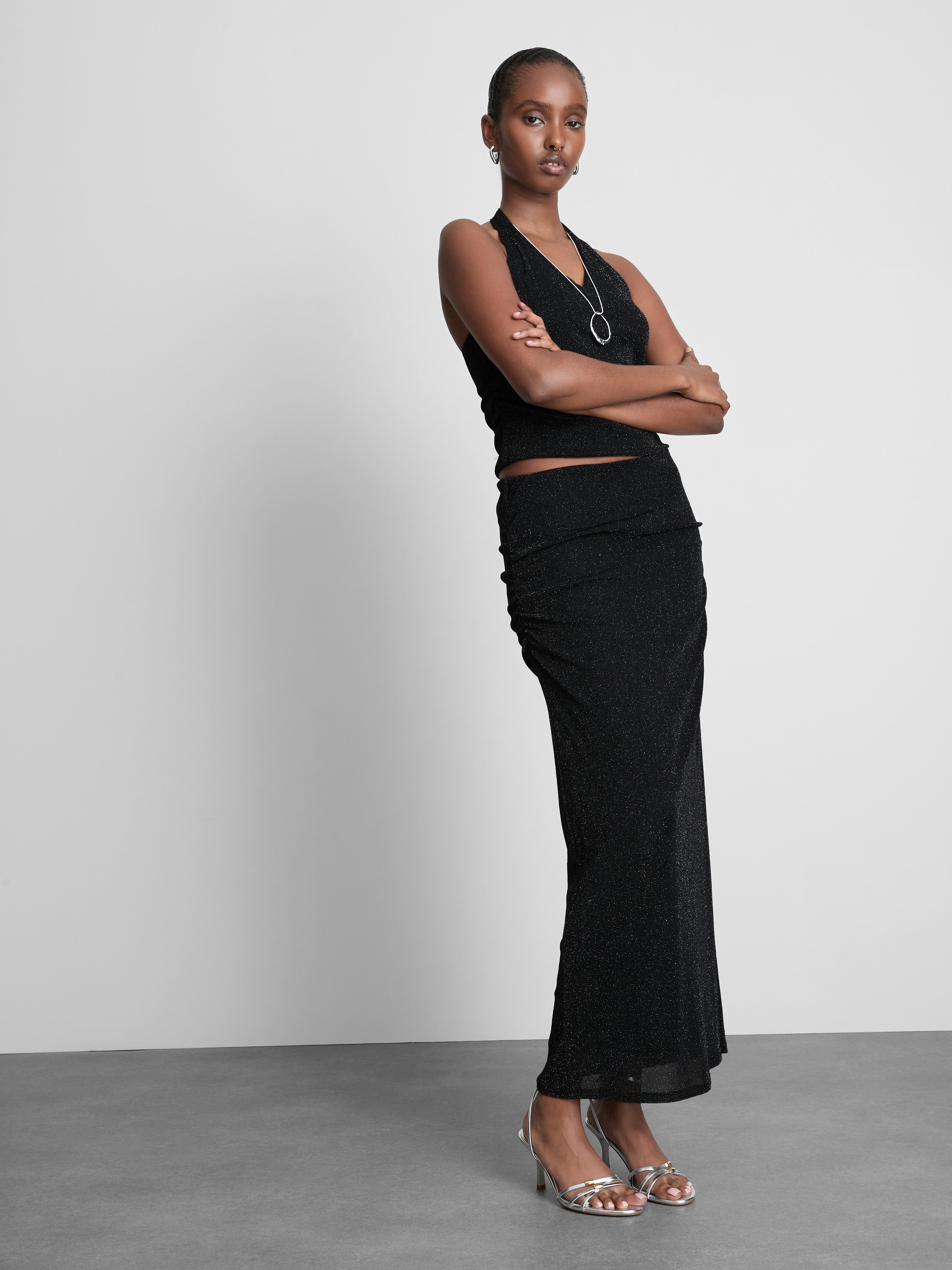 Csillogó, nyakba kötős felső