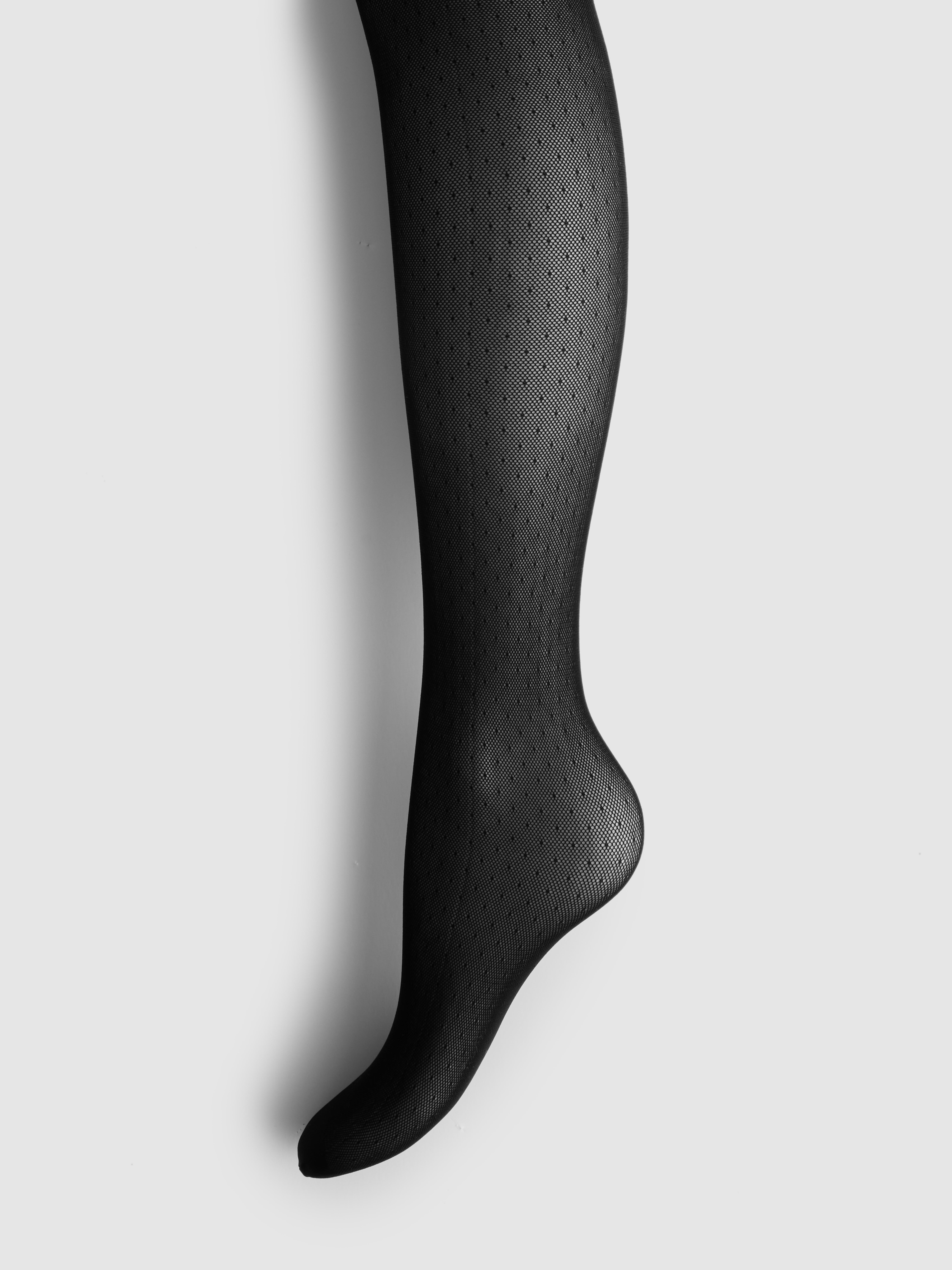 Collants en résille à pois