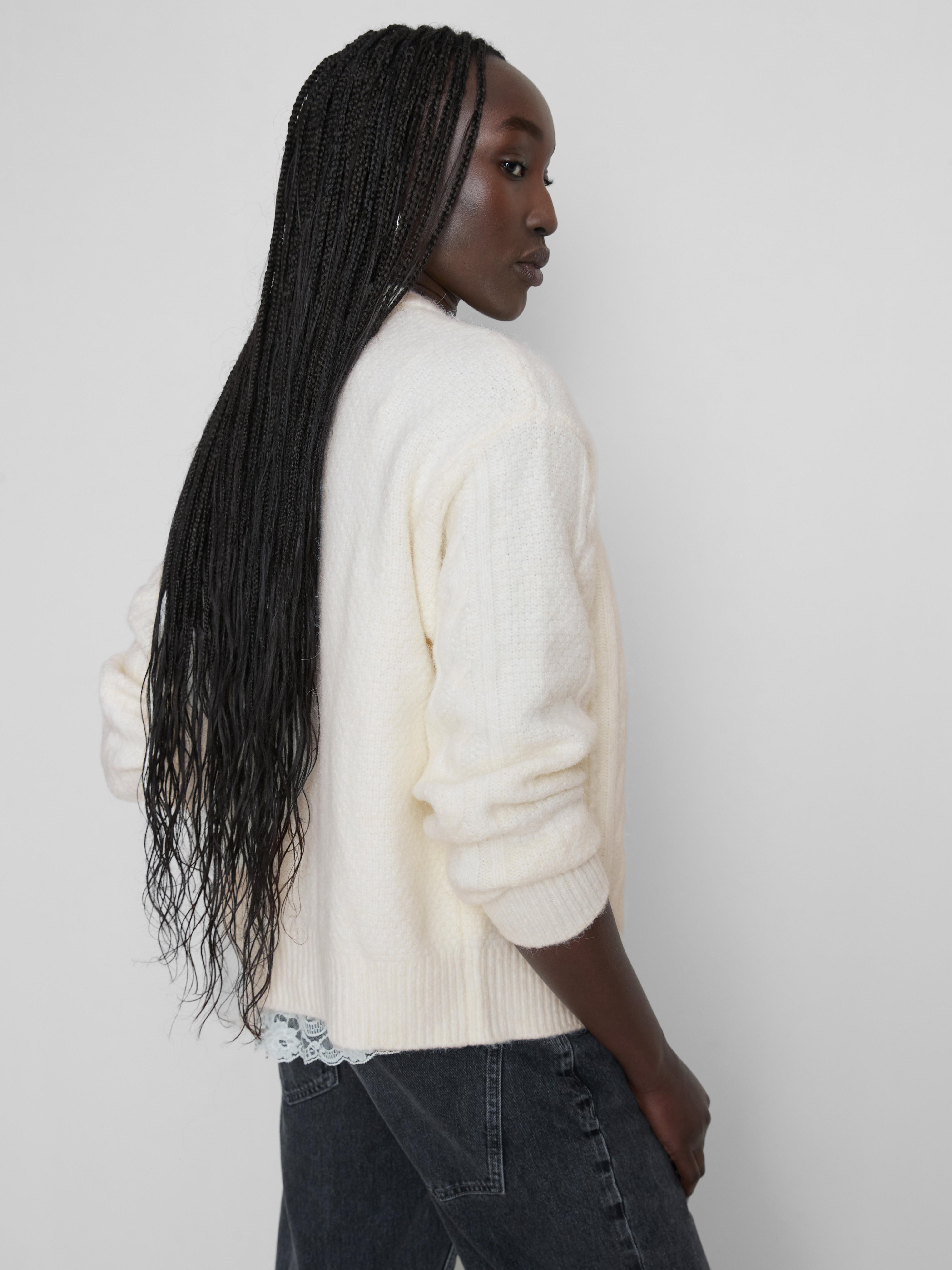 Cardigan in maglia a trecce con stella