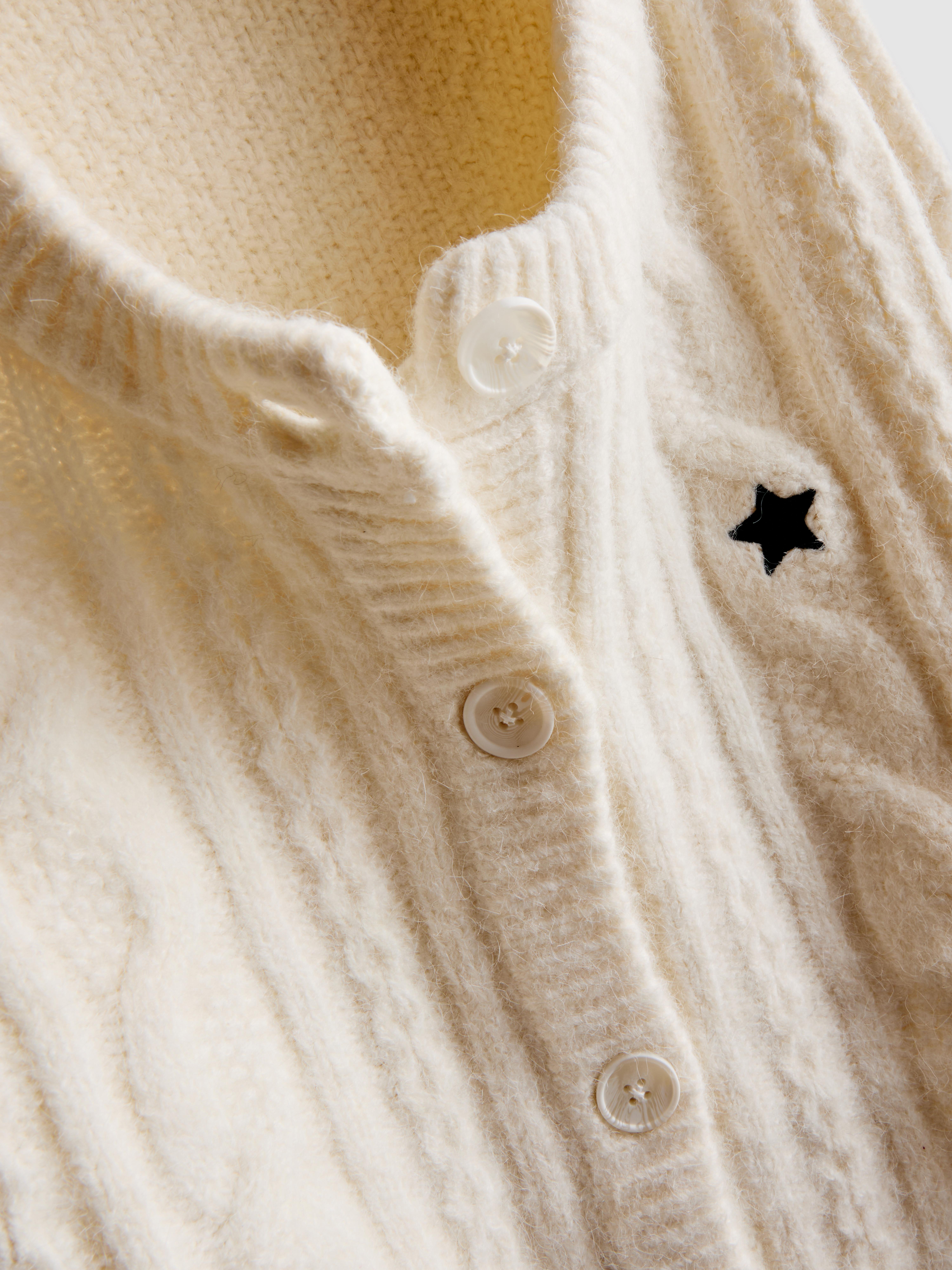 Cardigan in maglia a trecce con stella