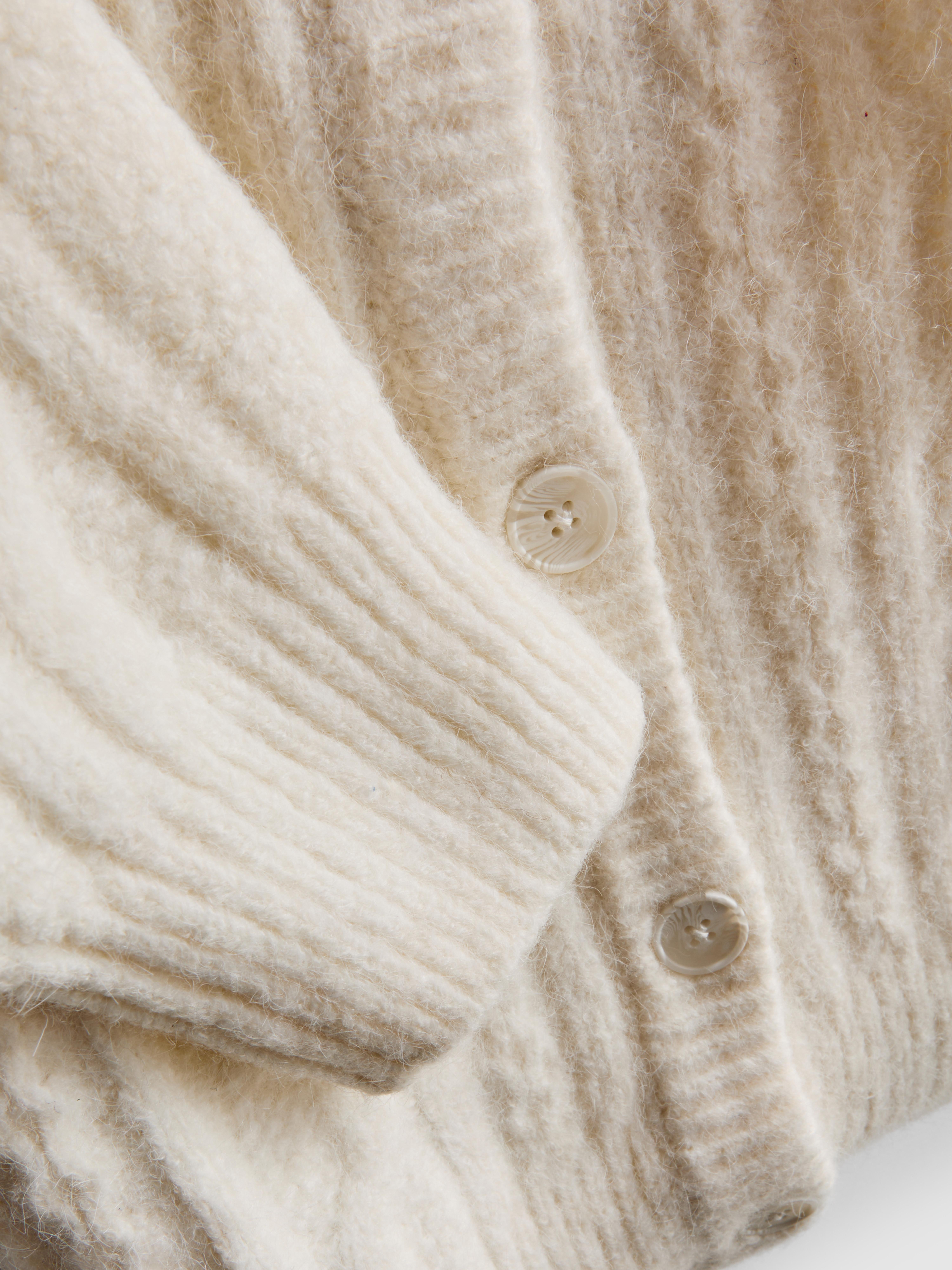 Cardigan in maglia a trecce con stella