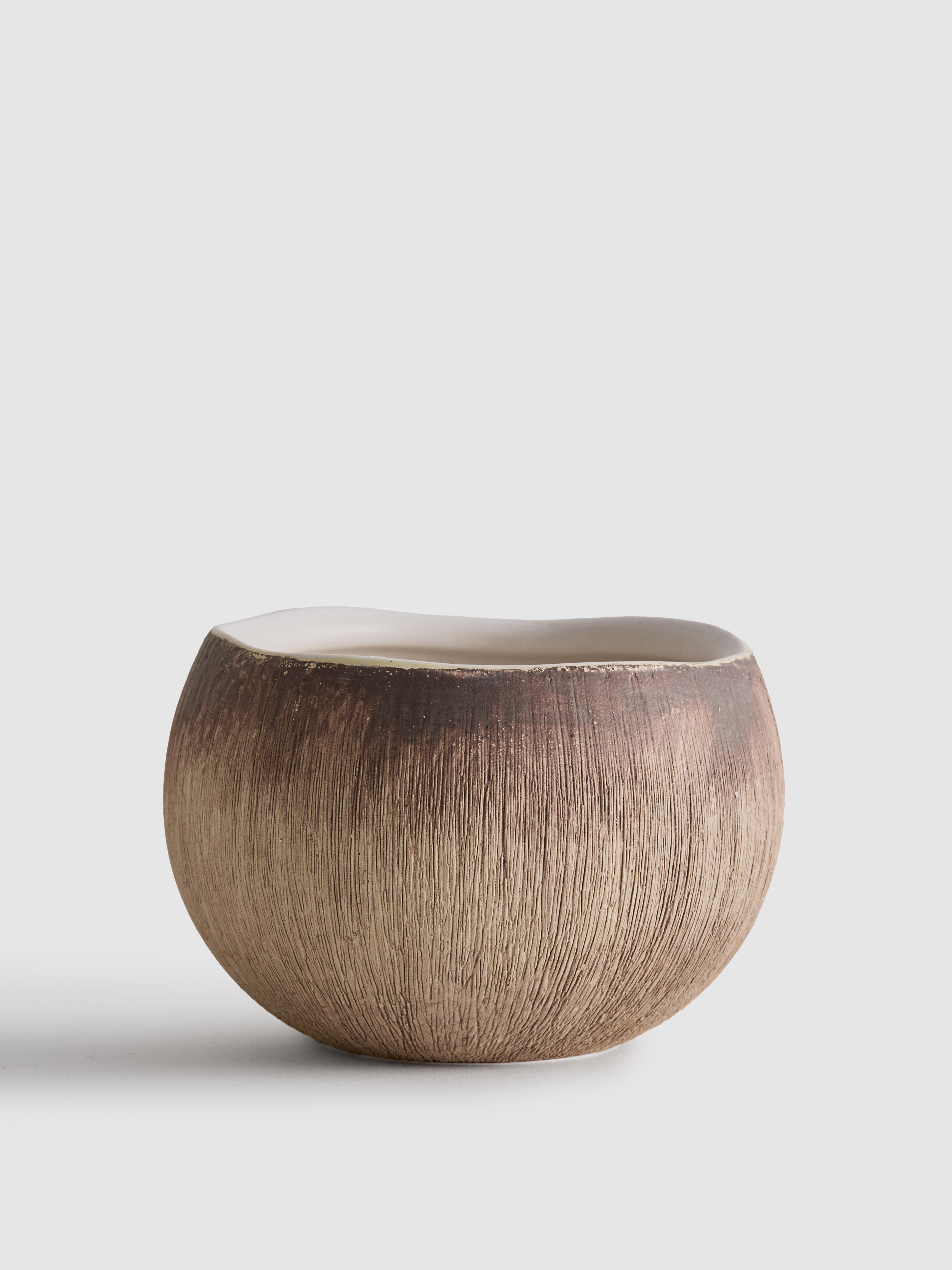 Brown Scented Candle In Coconut Containe