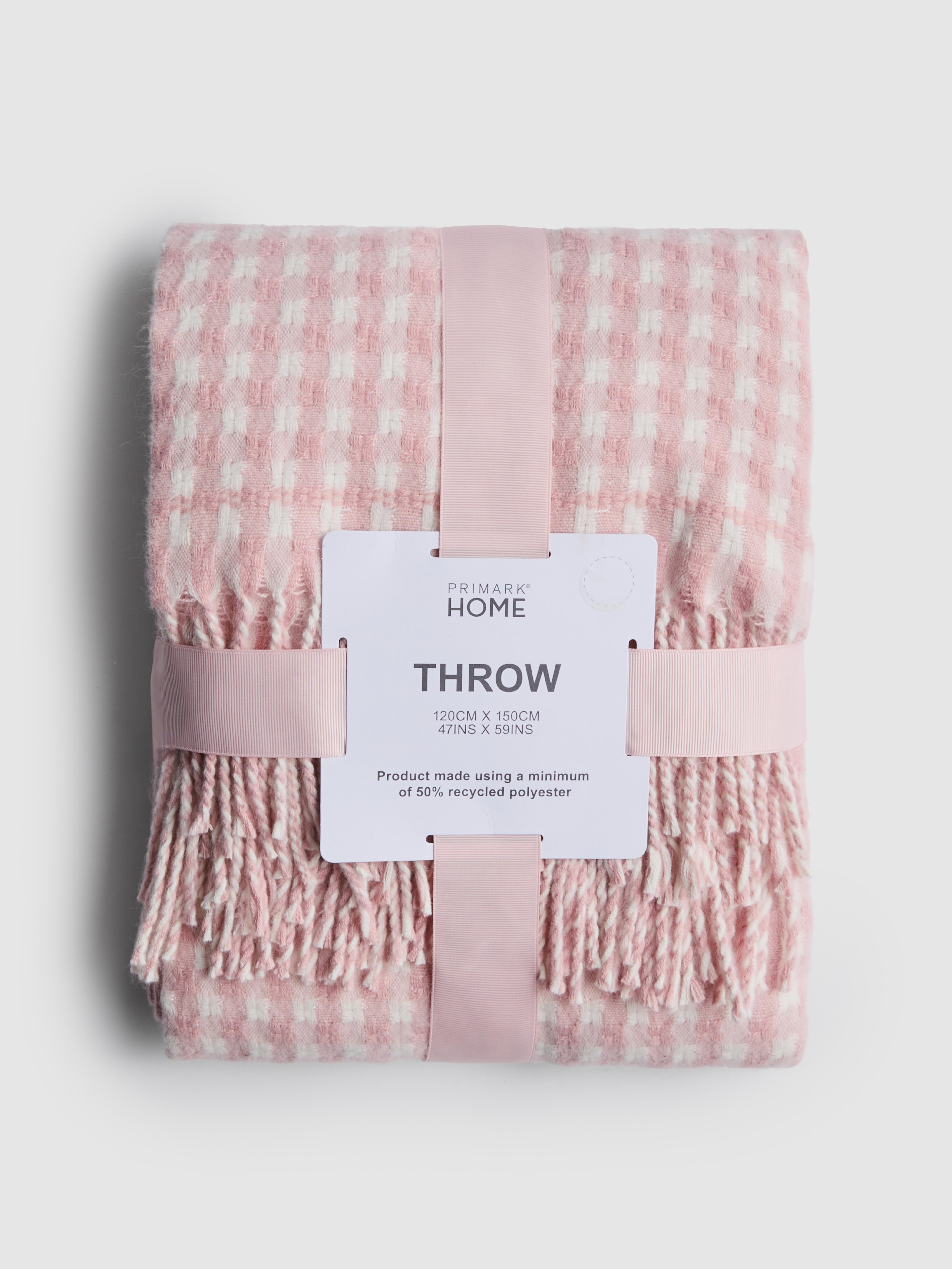 Coperta a quadretti con nappine