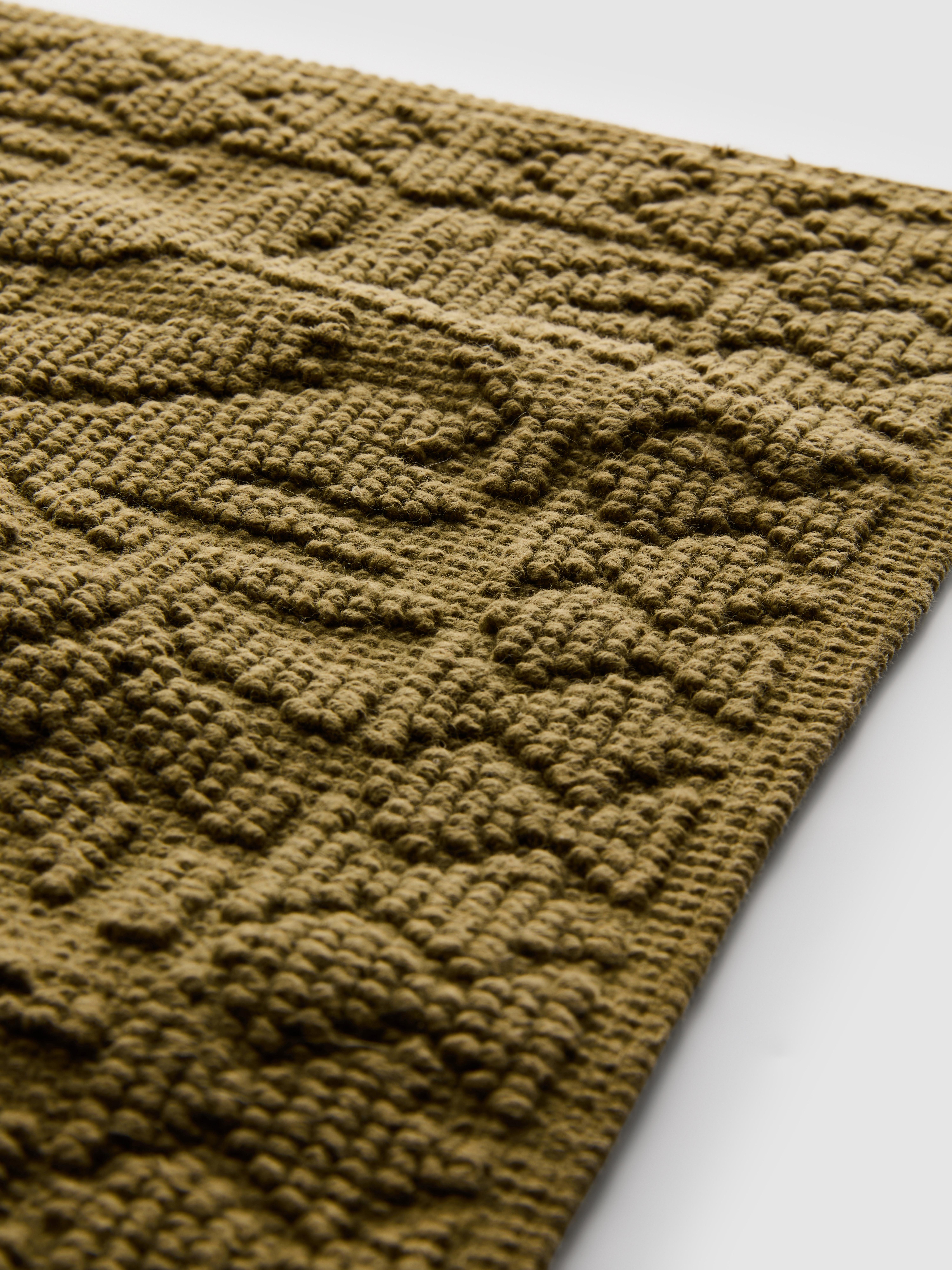 Badmat met bladmotief