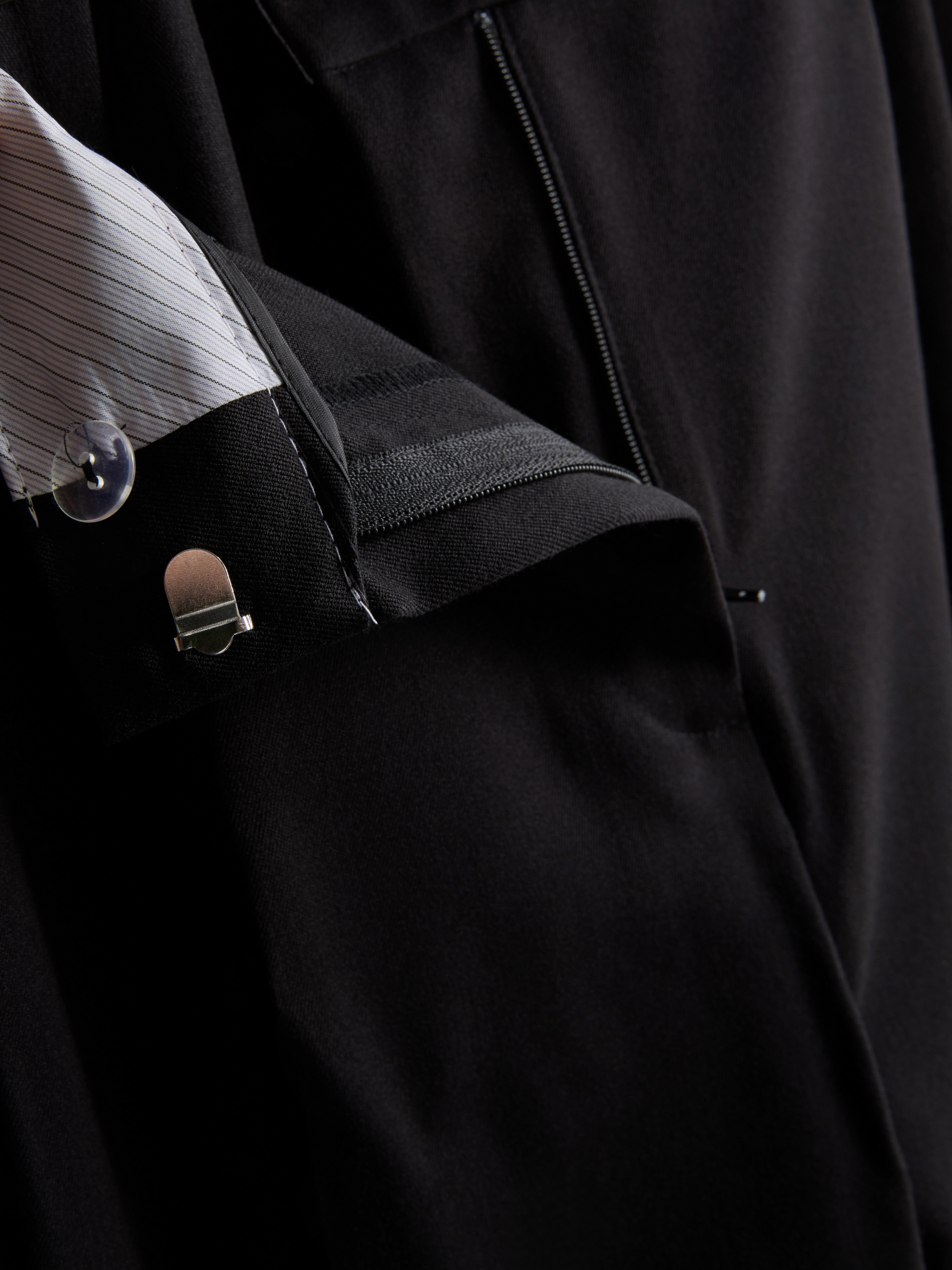 Pantalón plisado de pernera ancha