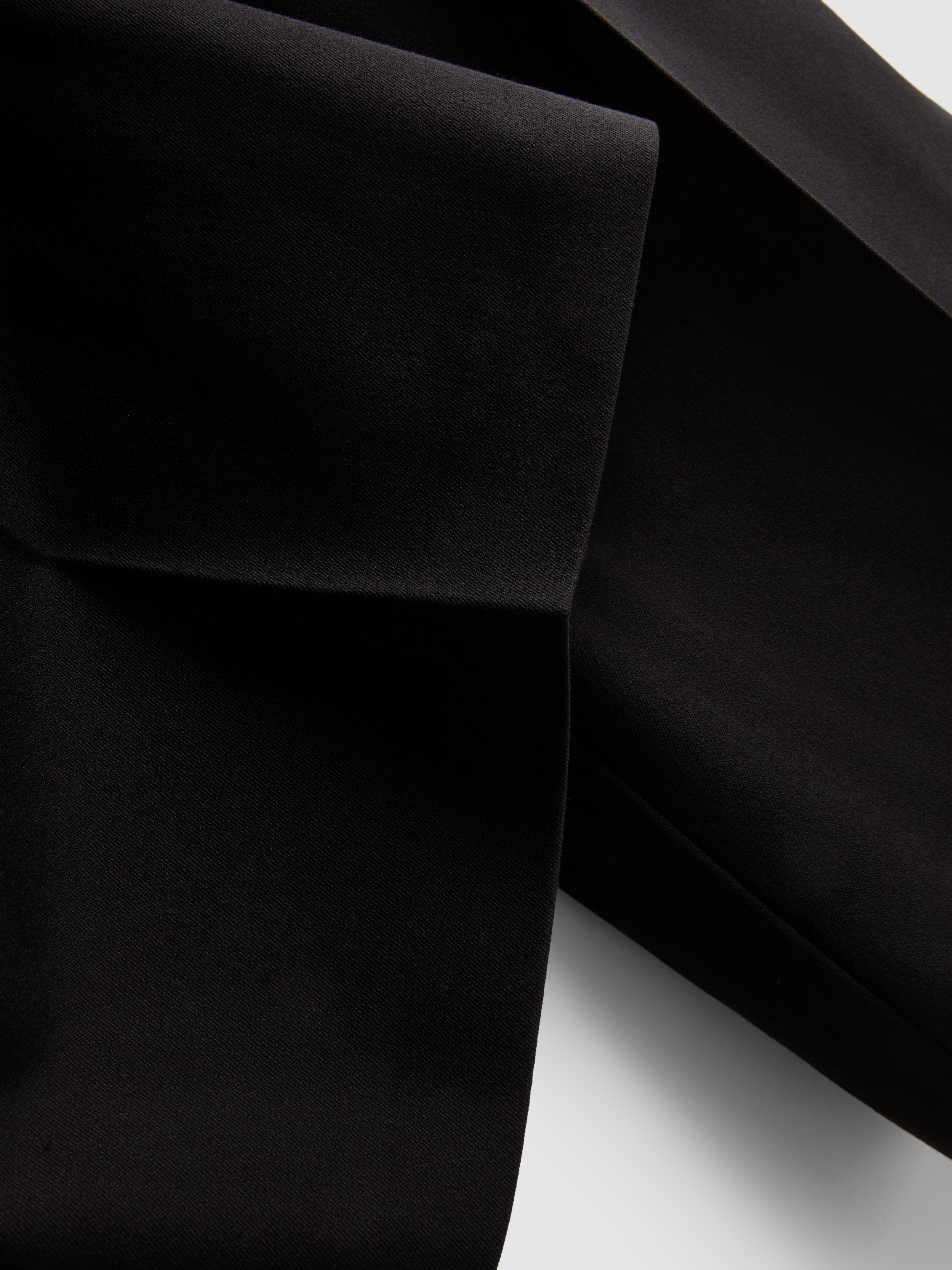 Pantalón plisado de pernera ancha