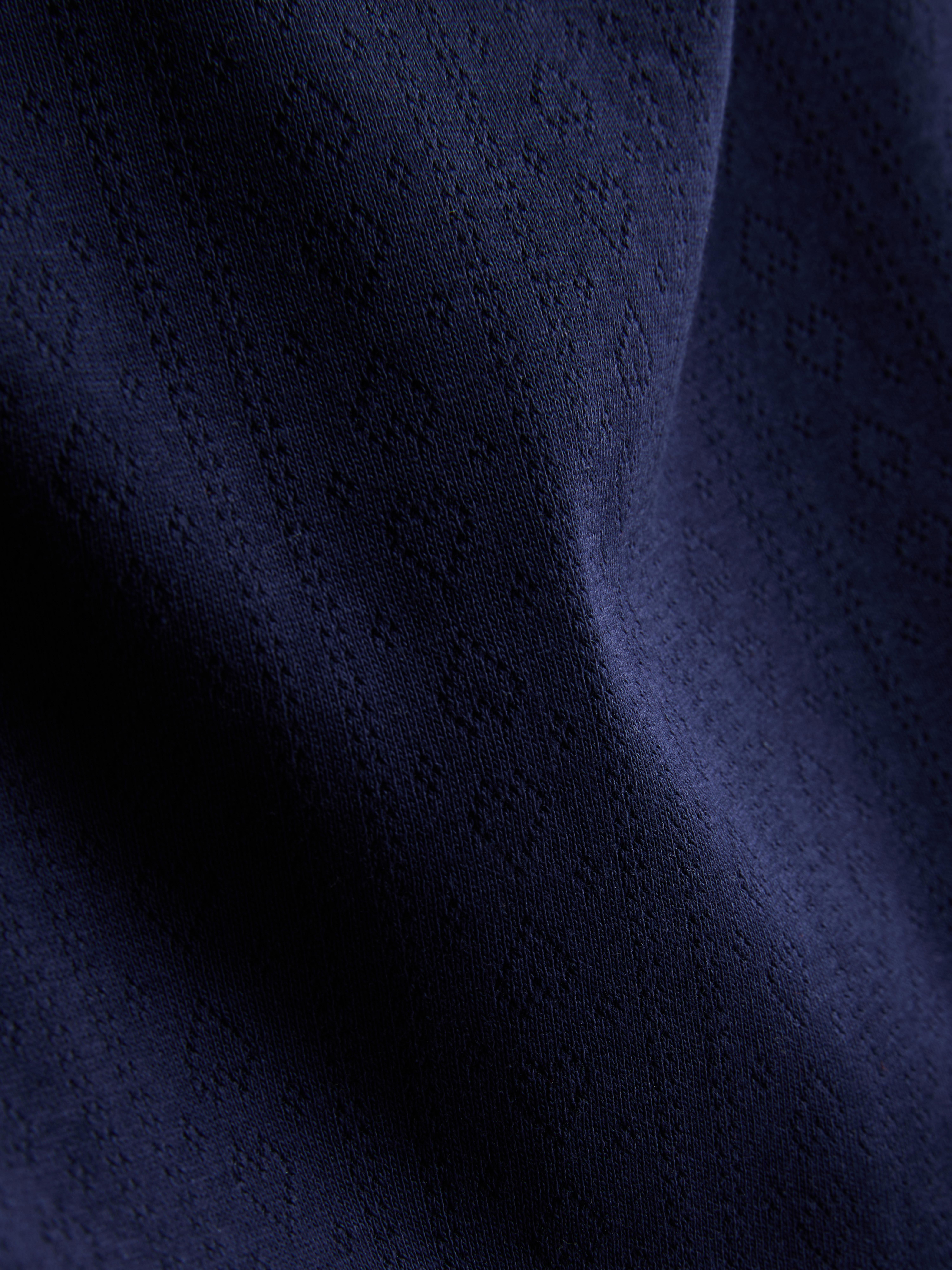 Bogaty w bawełnę, ażurowy top na ramiączkach