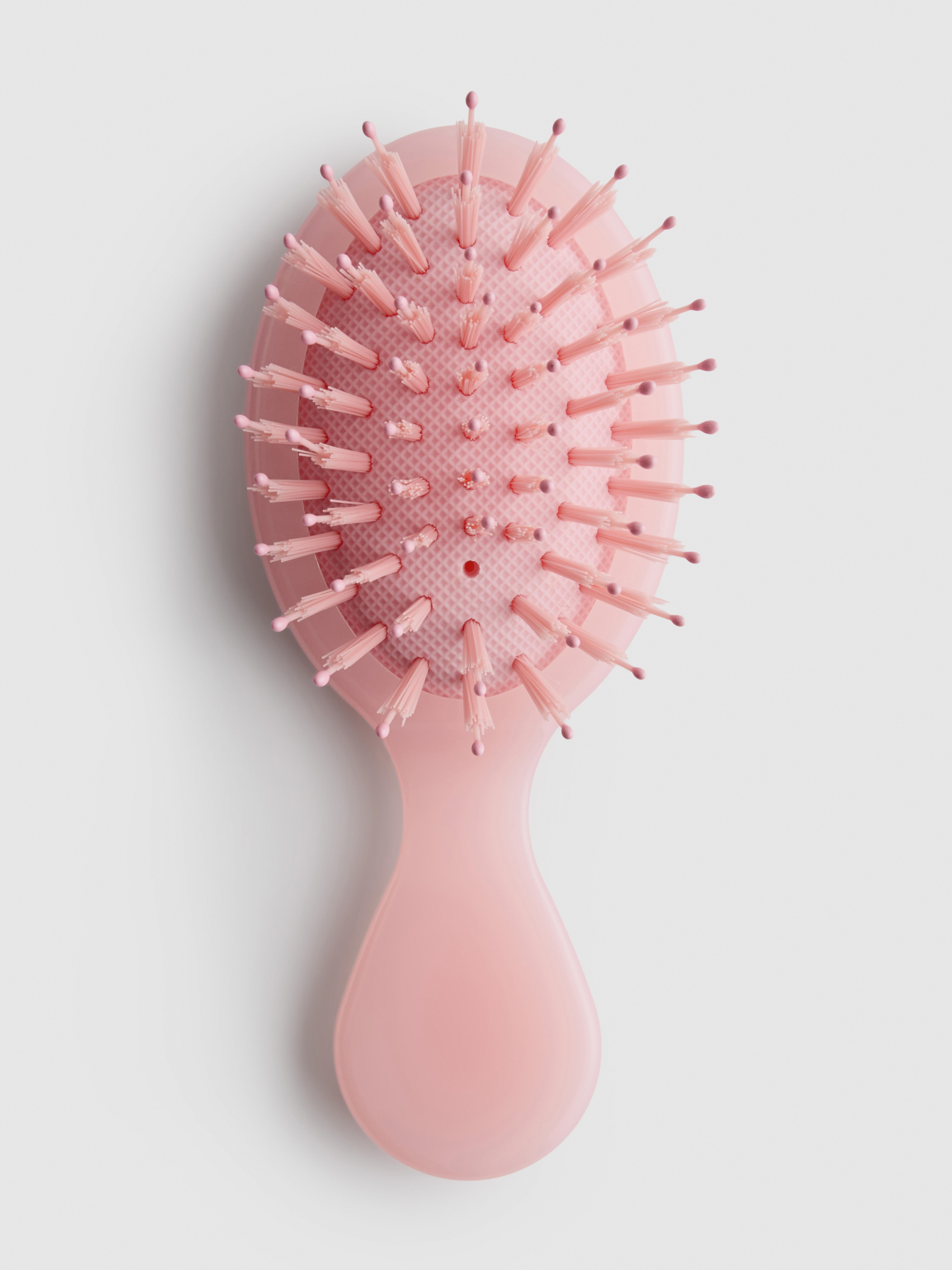 Mini spazzola per capelli piatta