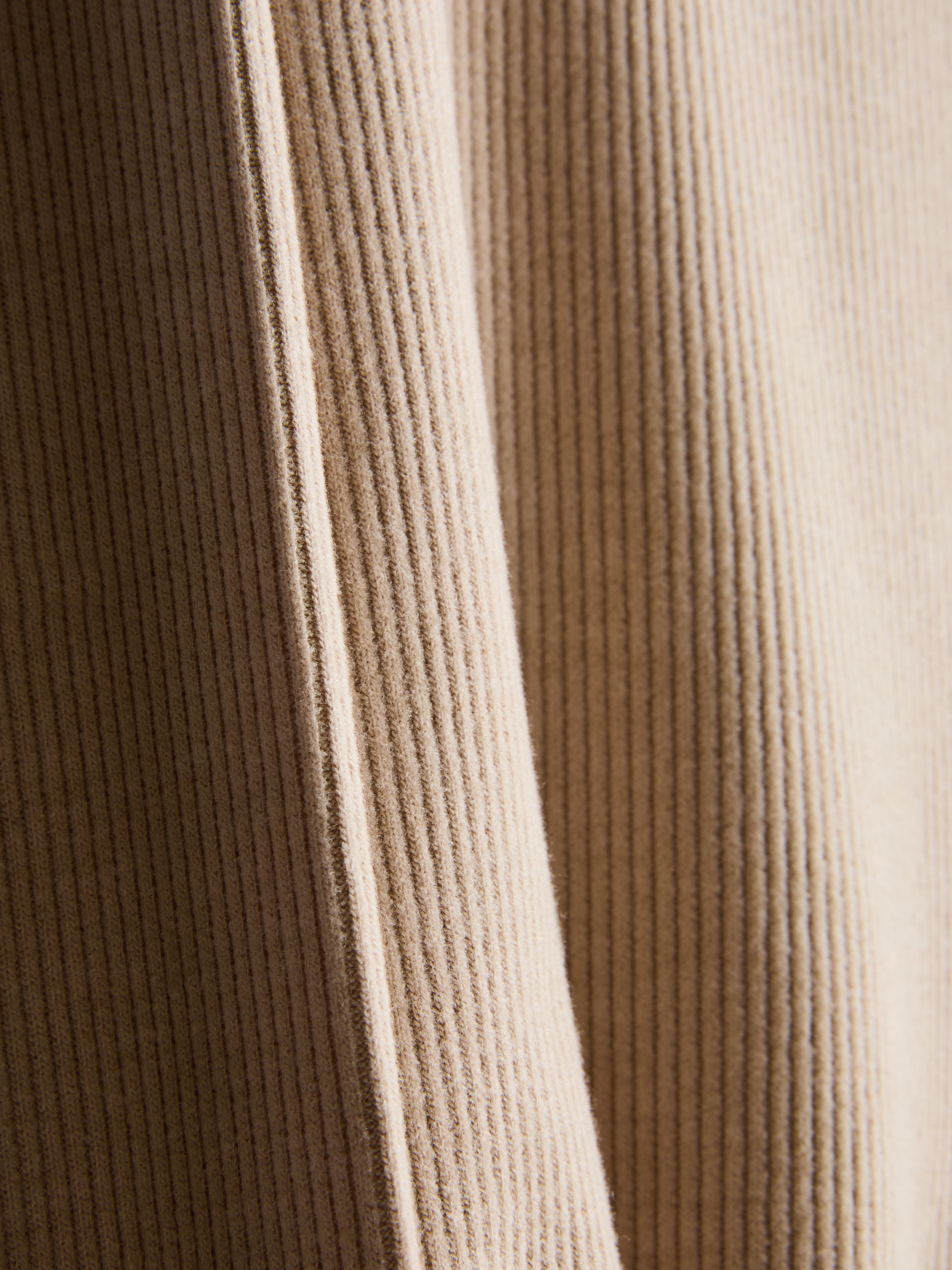 Casaco malha canelada gola redonda