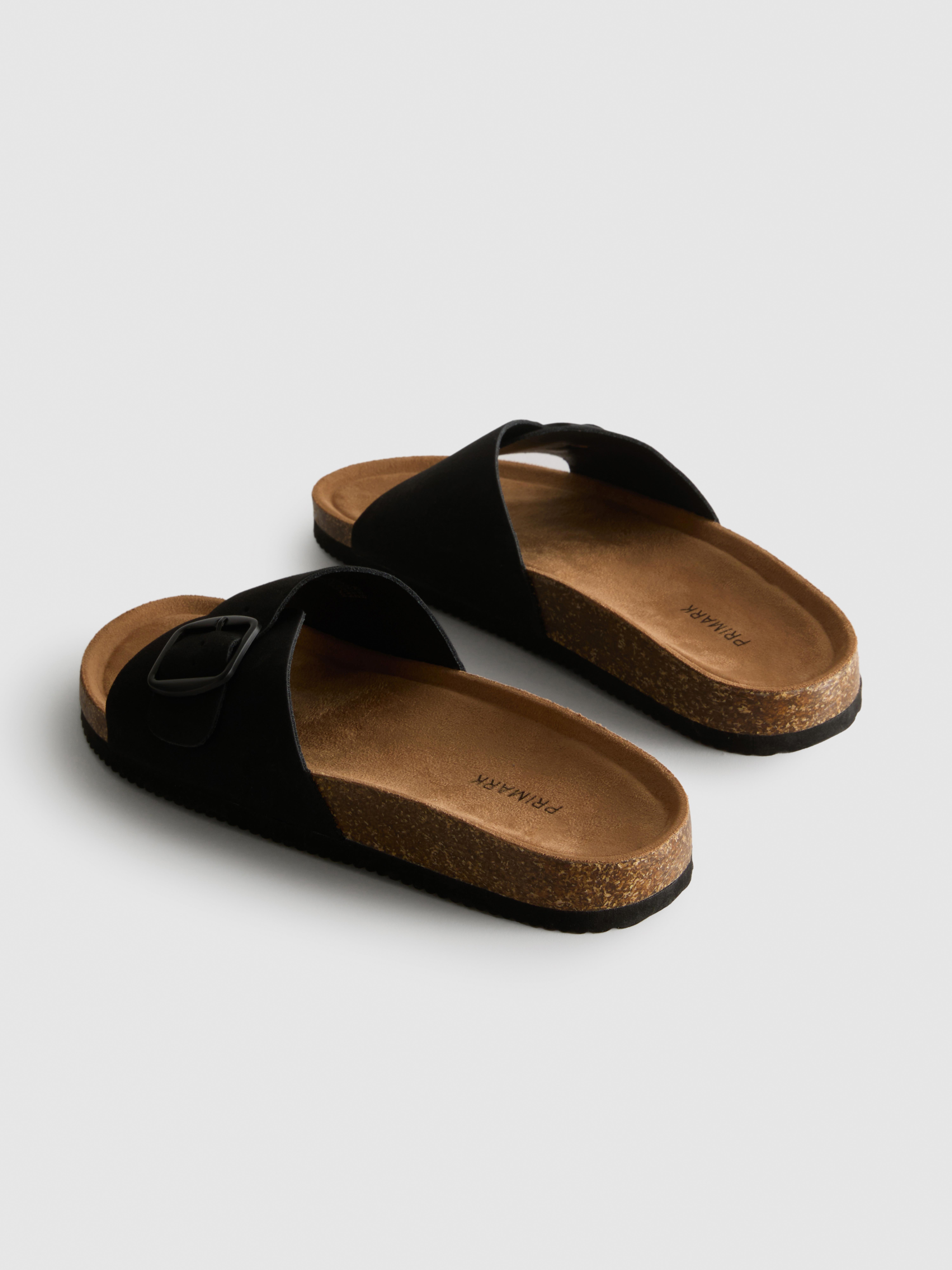 Sandalias destalonadas con tira con hebilla