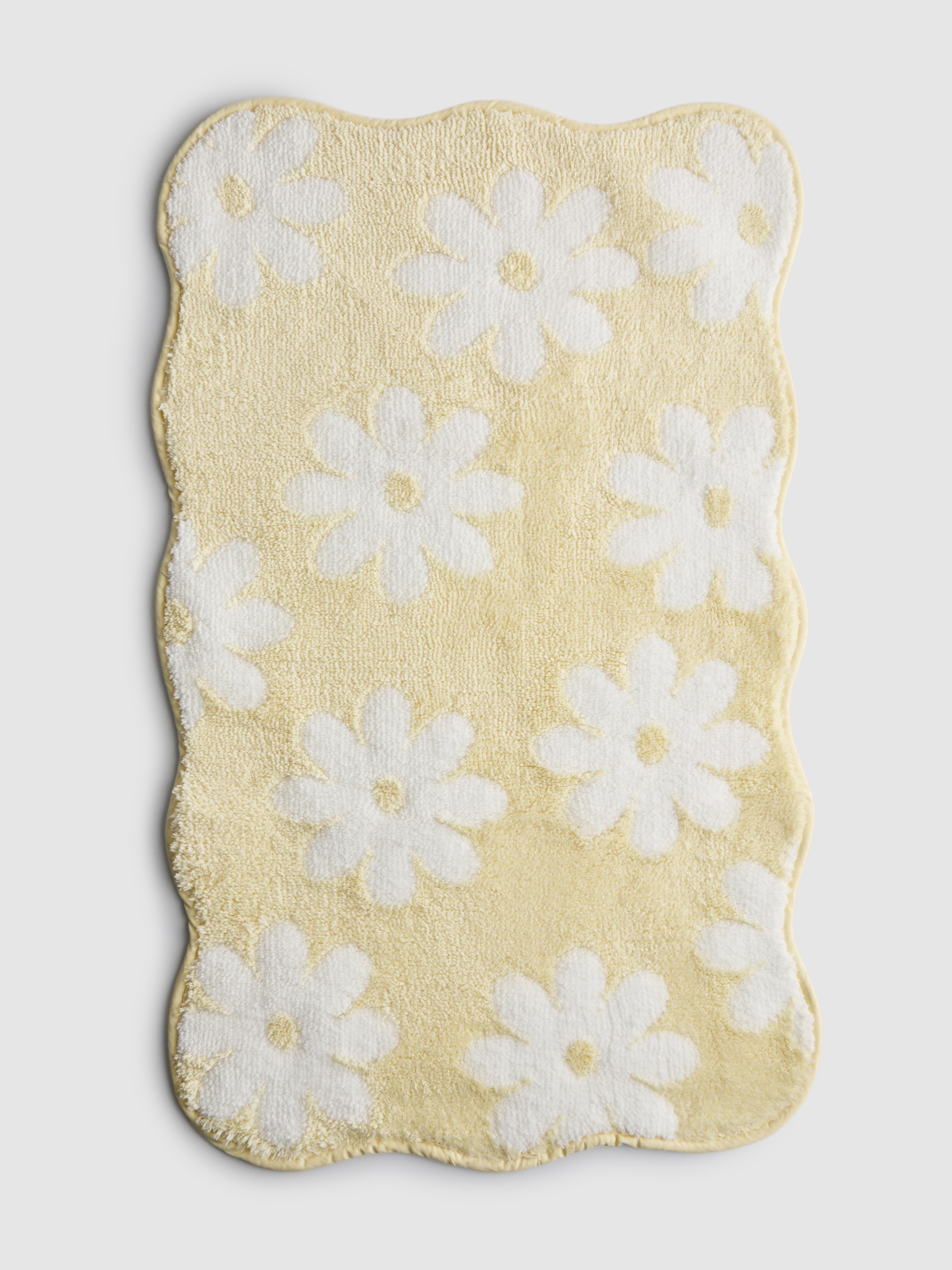 Tapis de bain festonné à marguerites