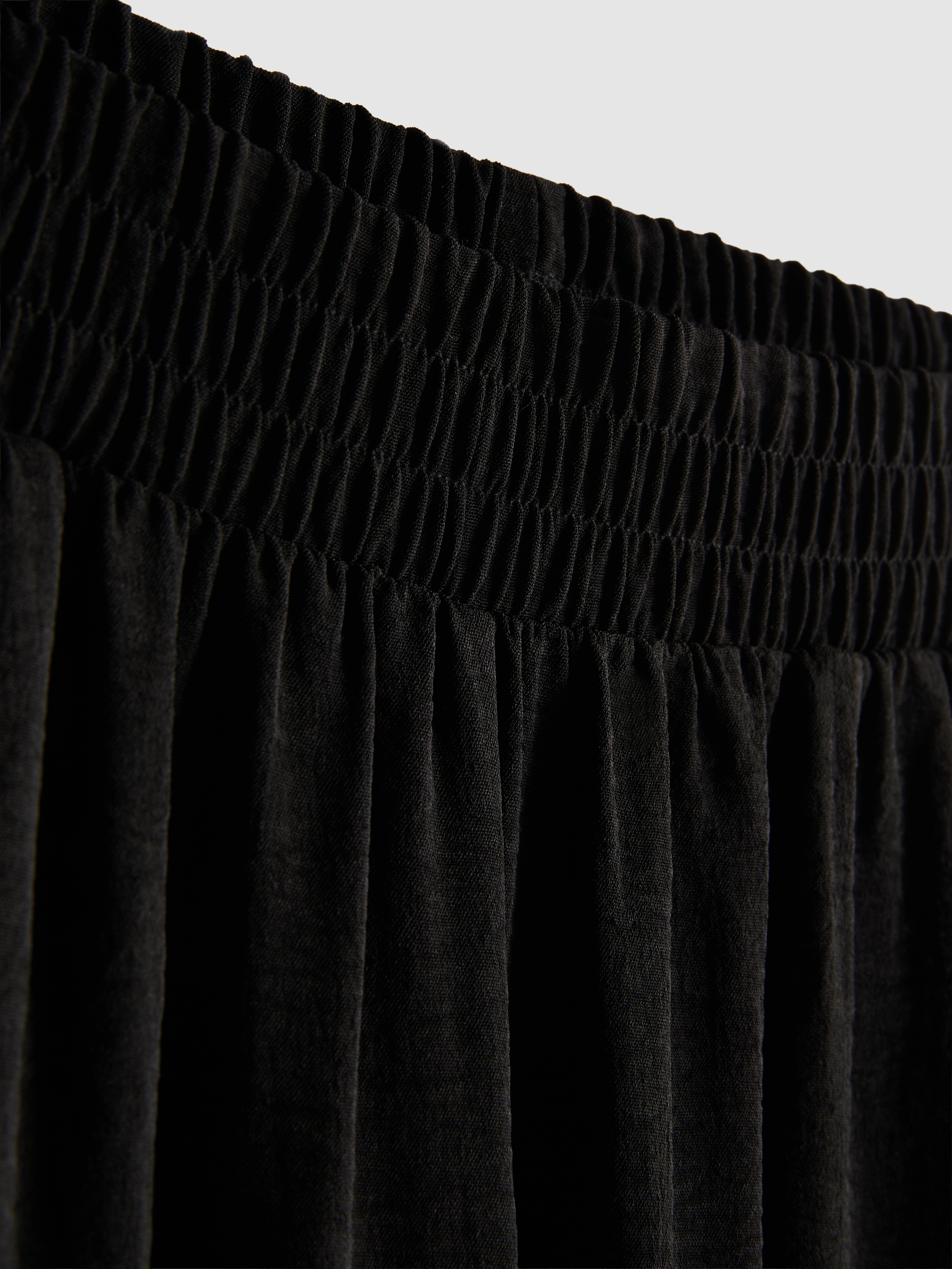 Pantalones de pernera ancha con cintura elástica