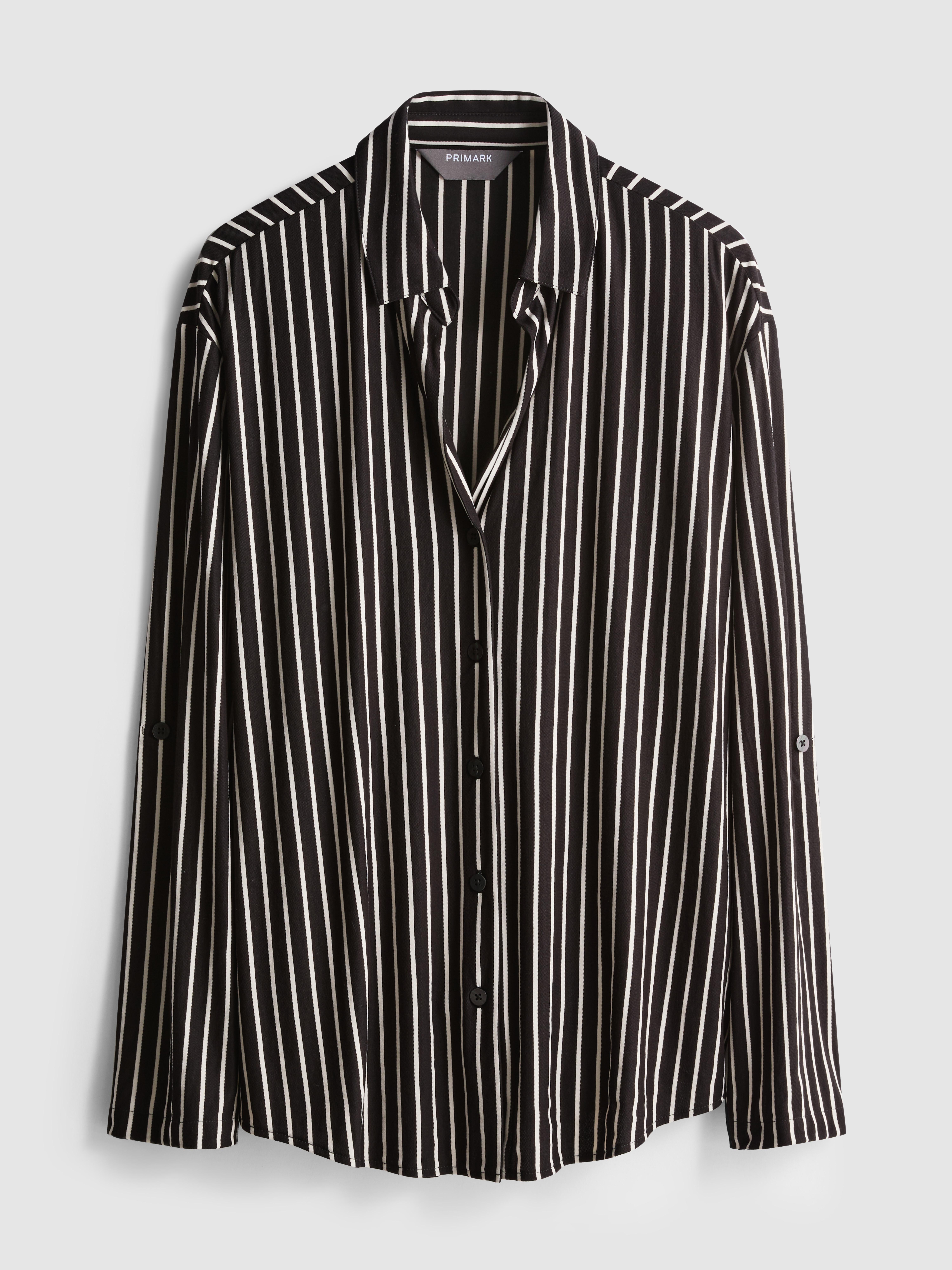 Camisa corte folgado bainha curva