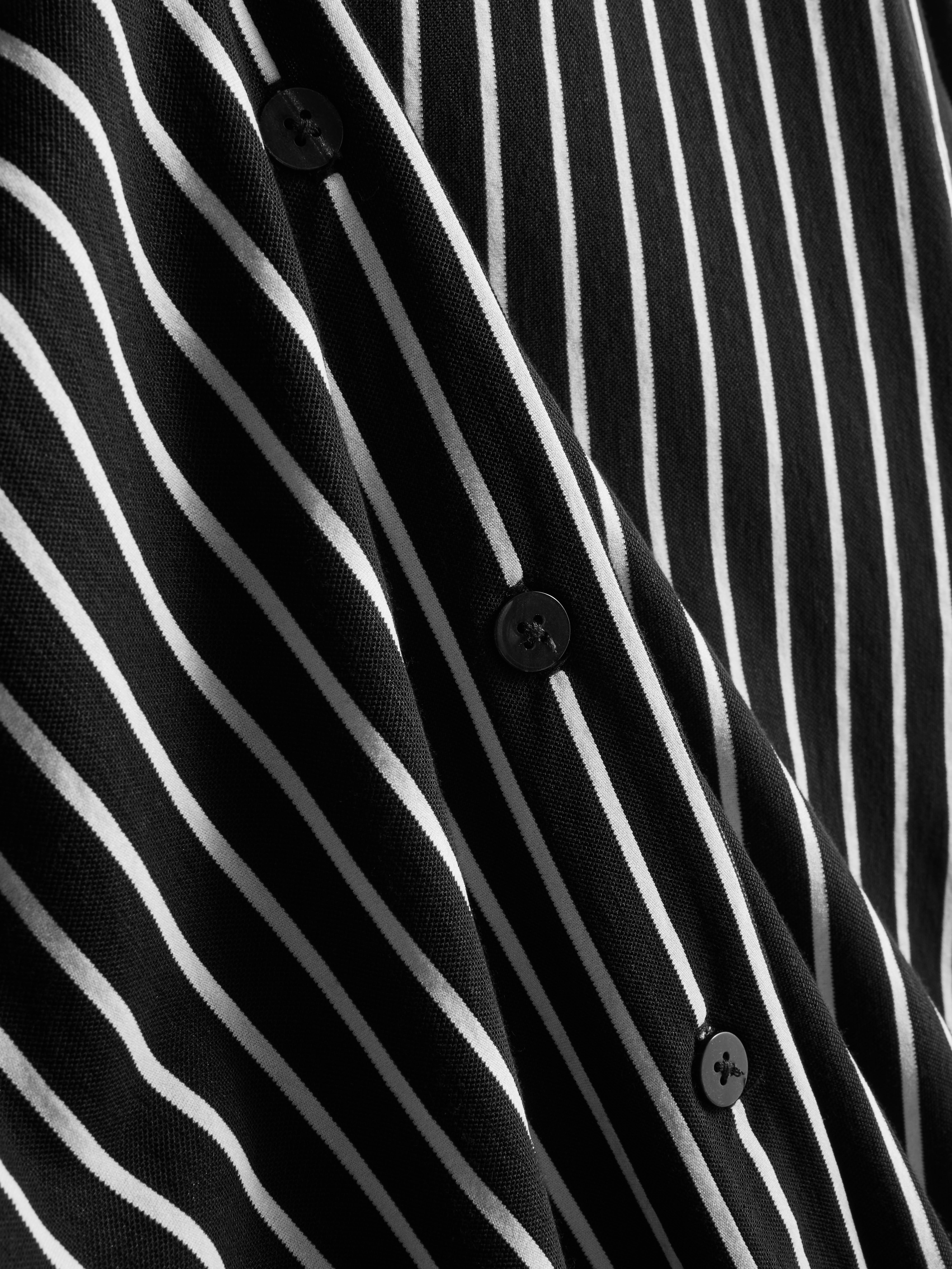 Camisa corte folgado bainha curva