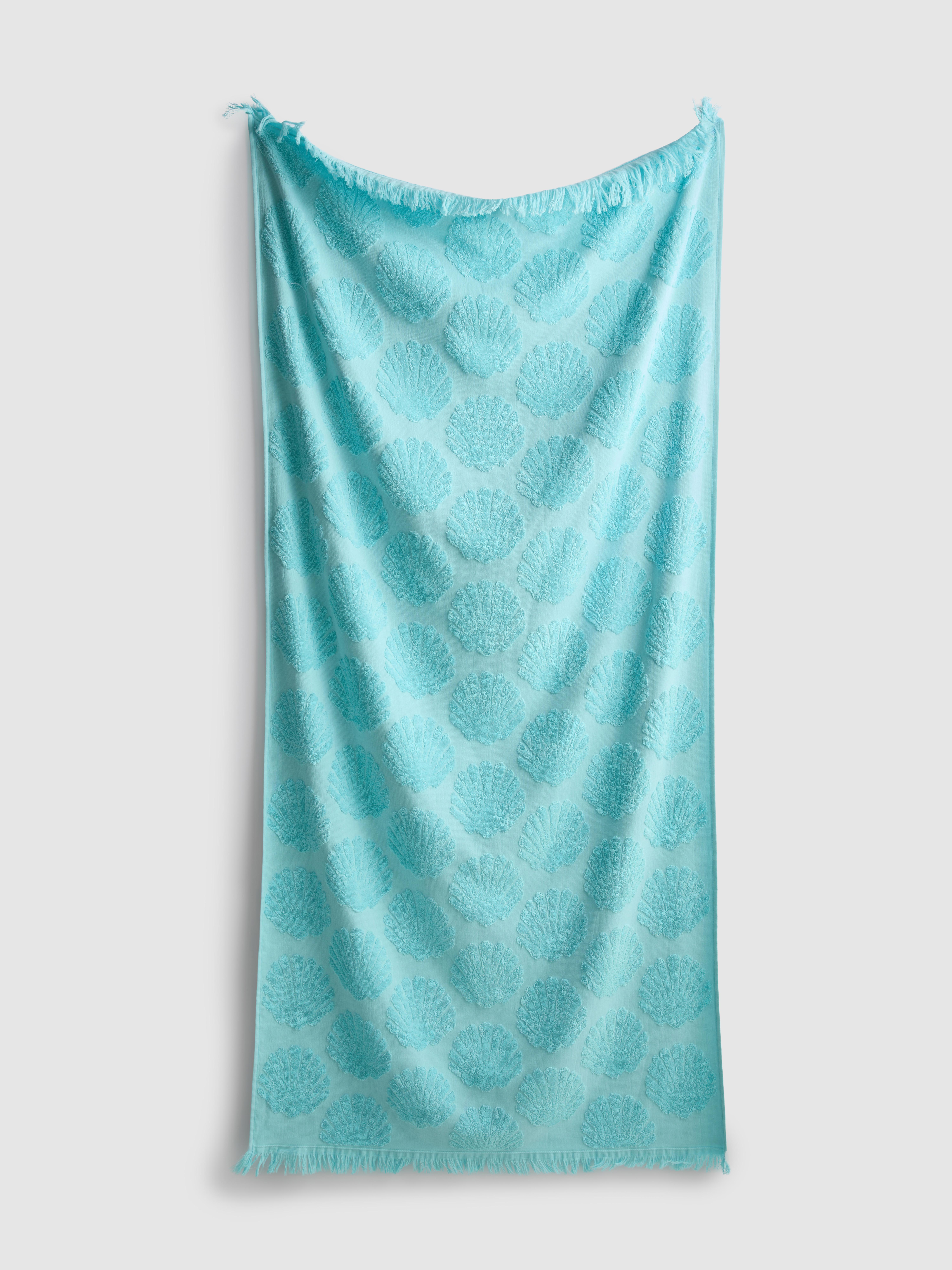 Toalla de playa con concha