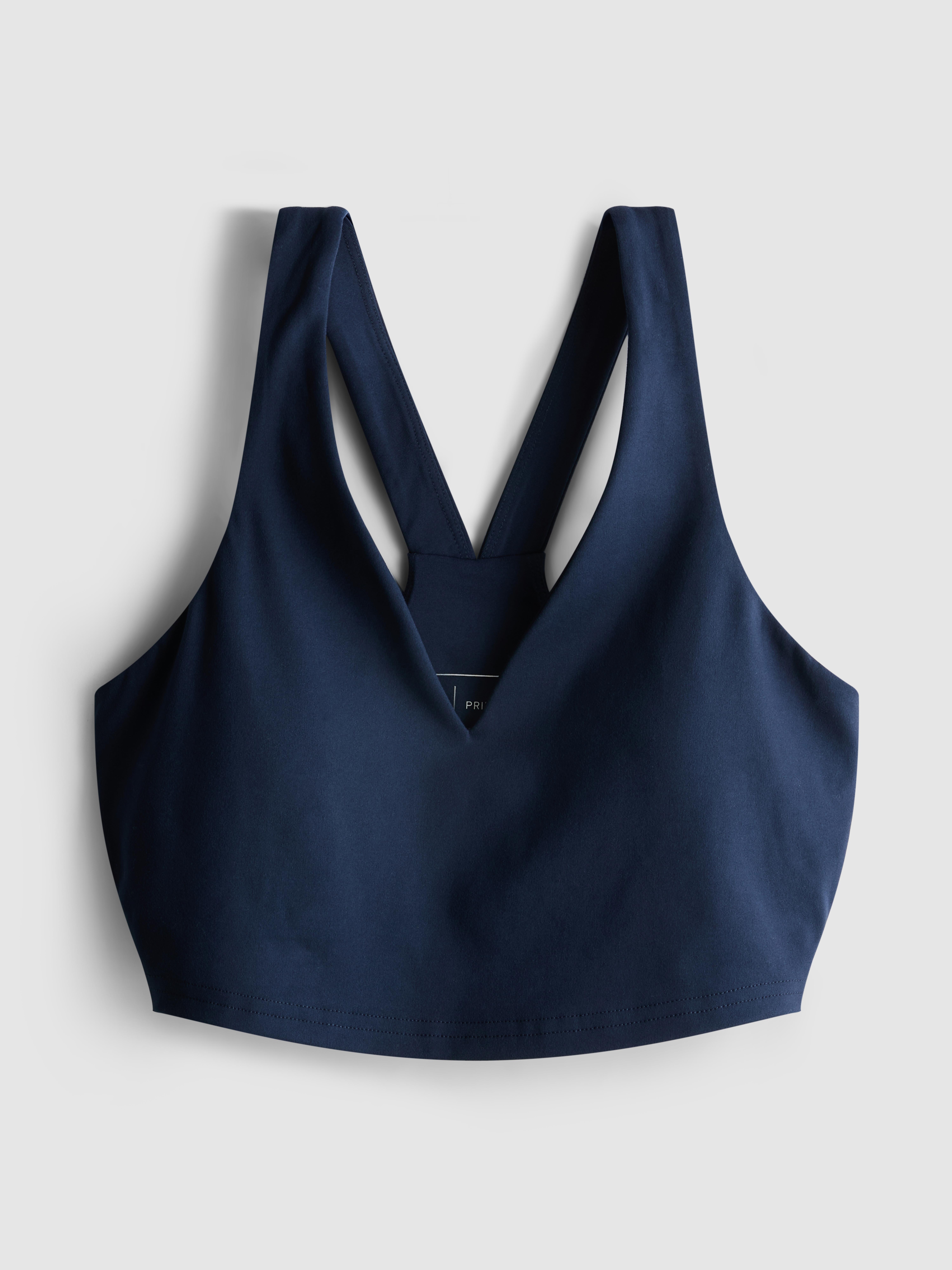 Kratek športni top z V-izrezom in zoženim hrbtom