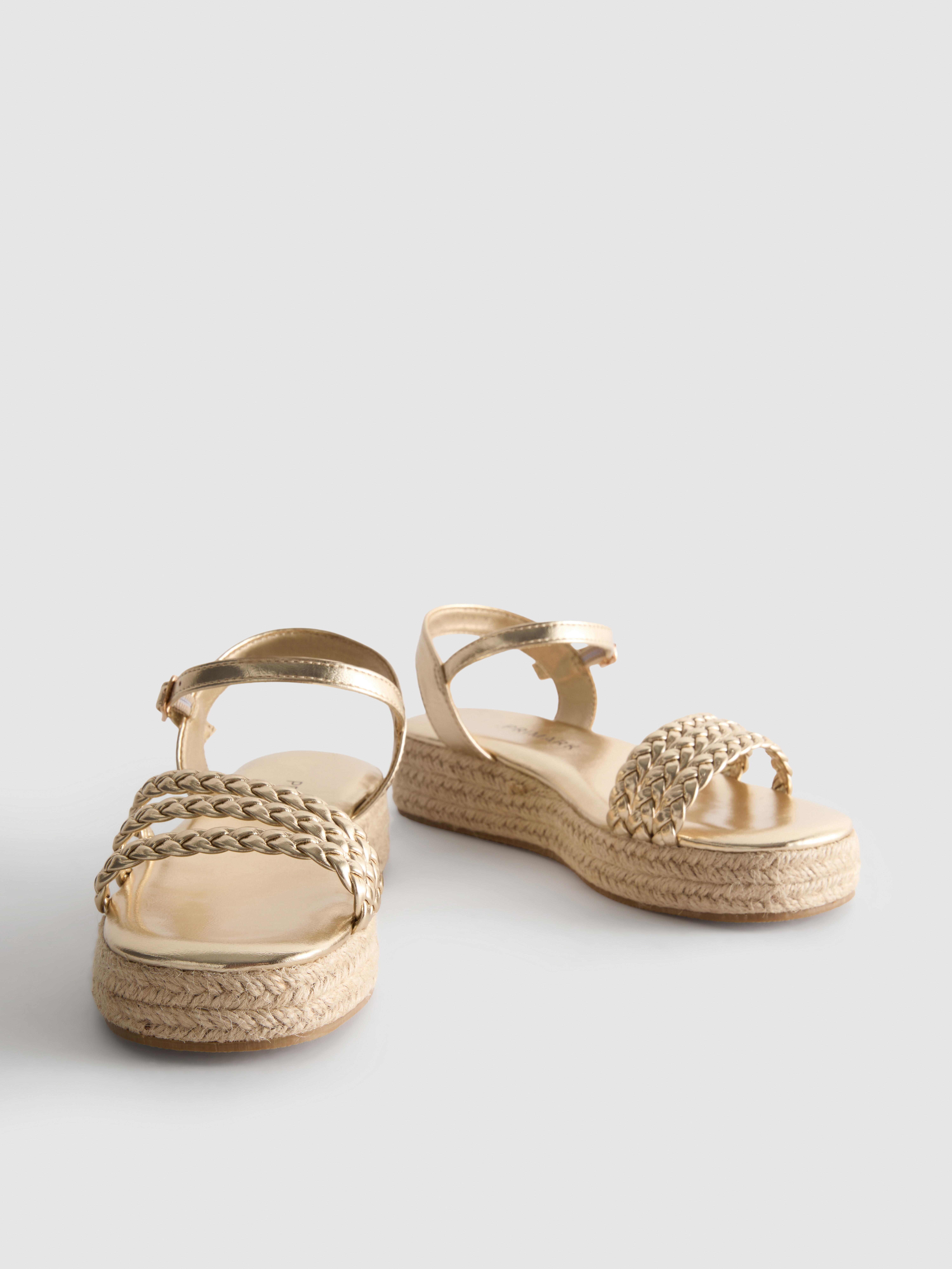 Sandalias tipo alpargata de cuña con tiras trenzadas