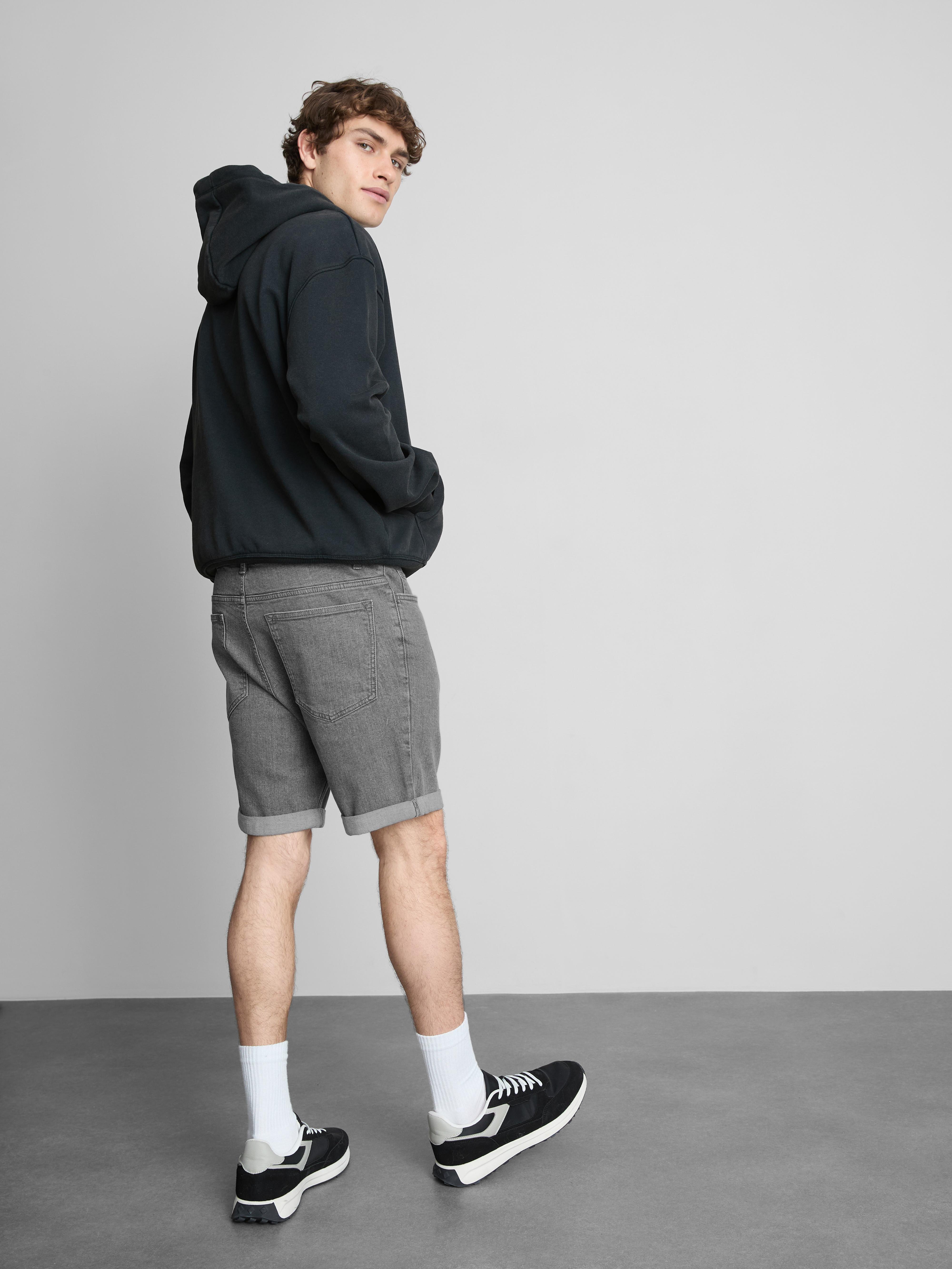 Calções ganga skinny cintura média