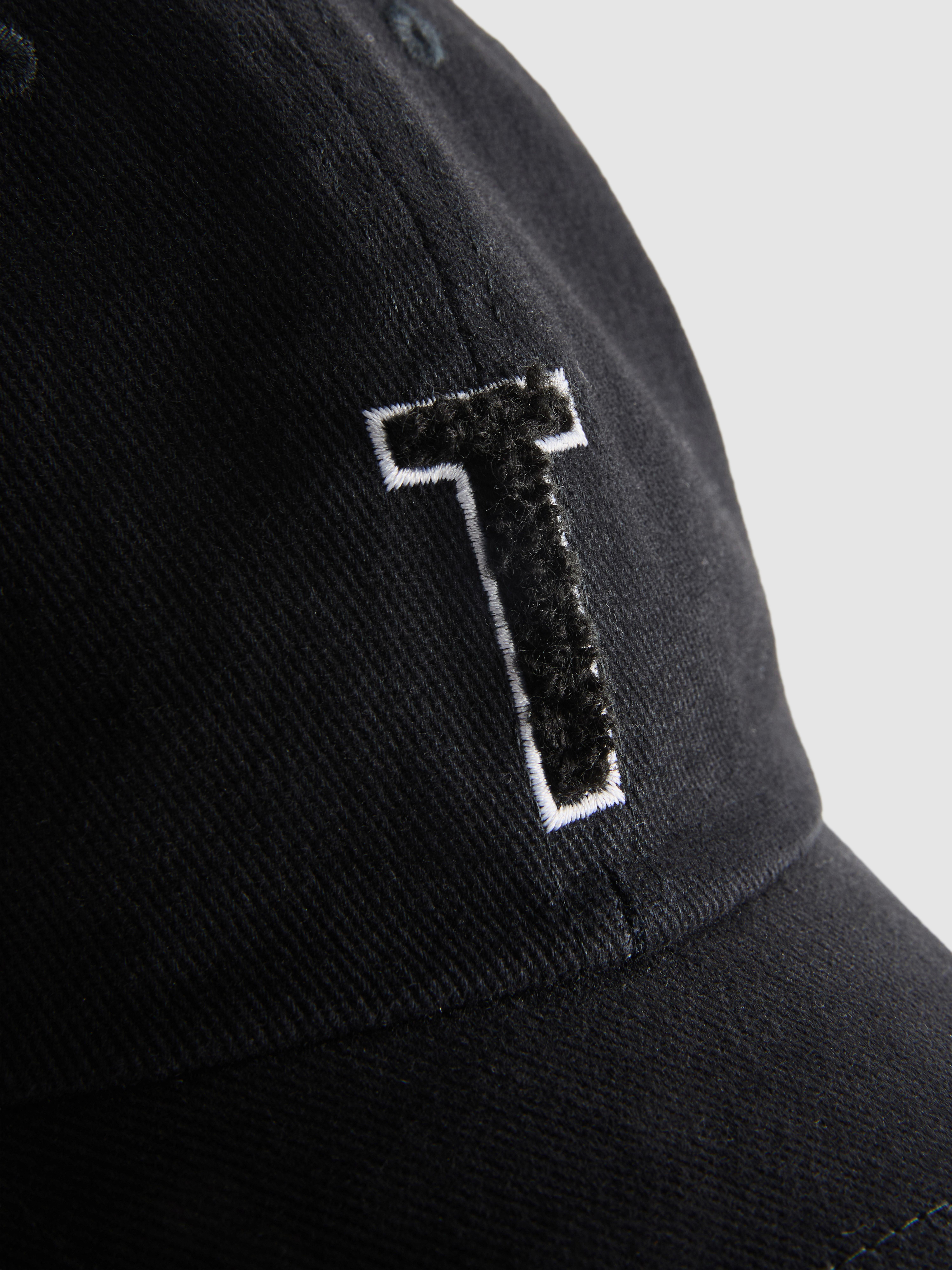 Tufted Initial Cap