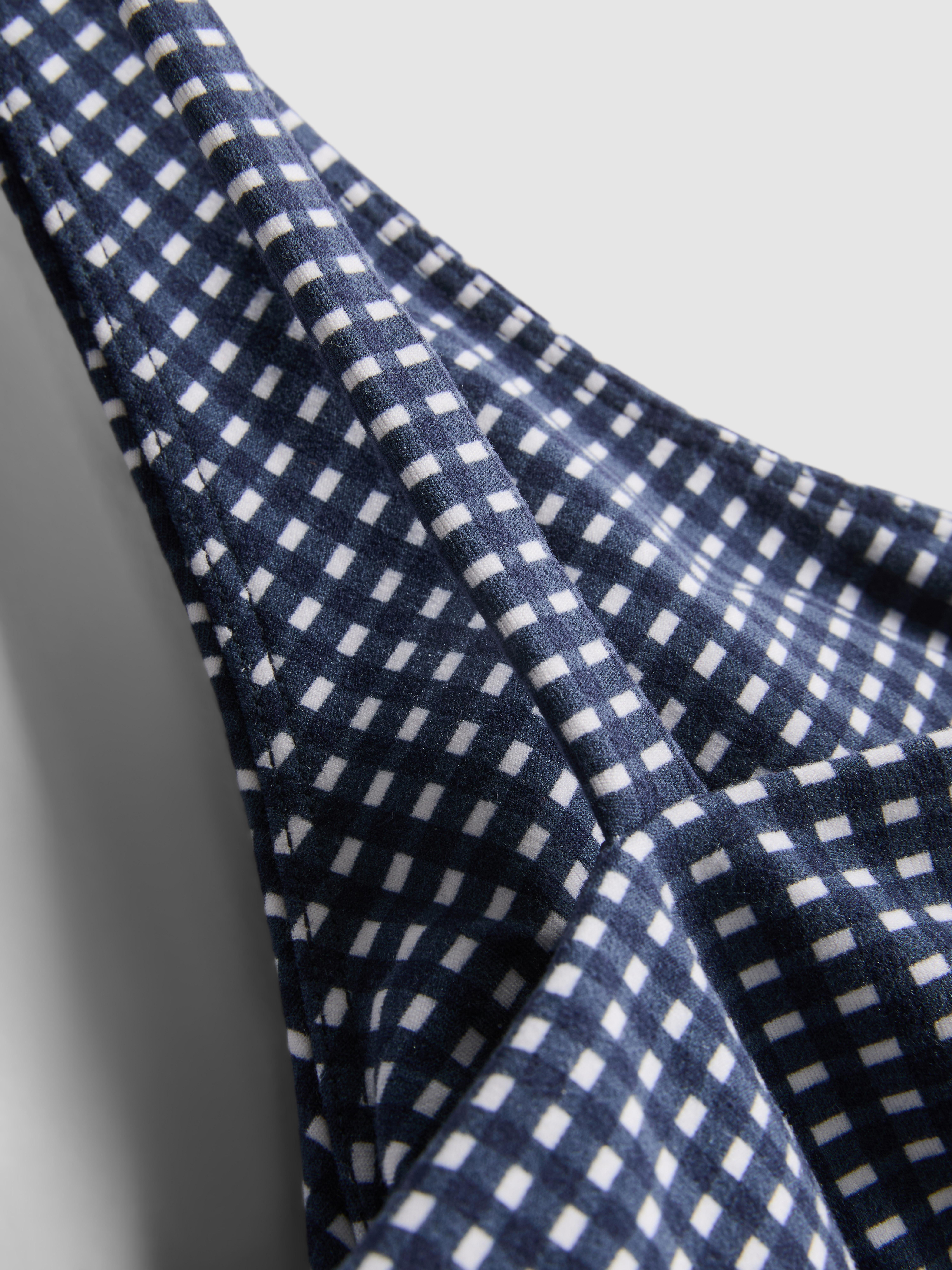 Haut de sport court vichy torsadé sur le devant