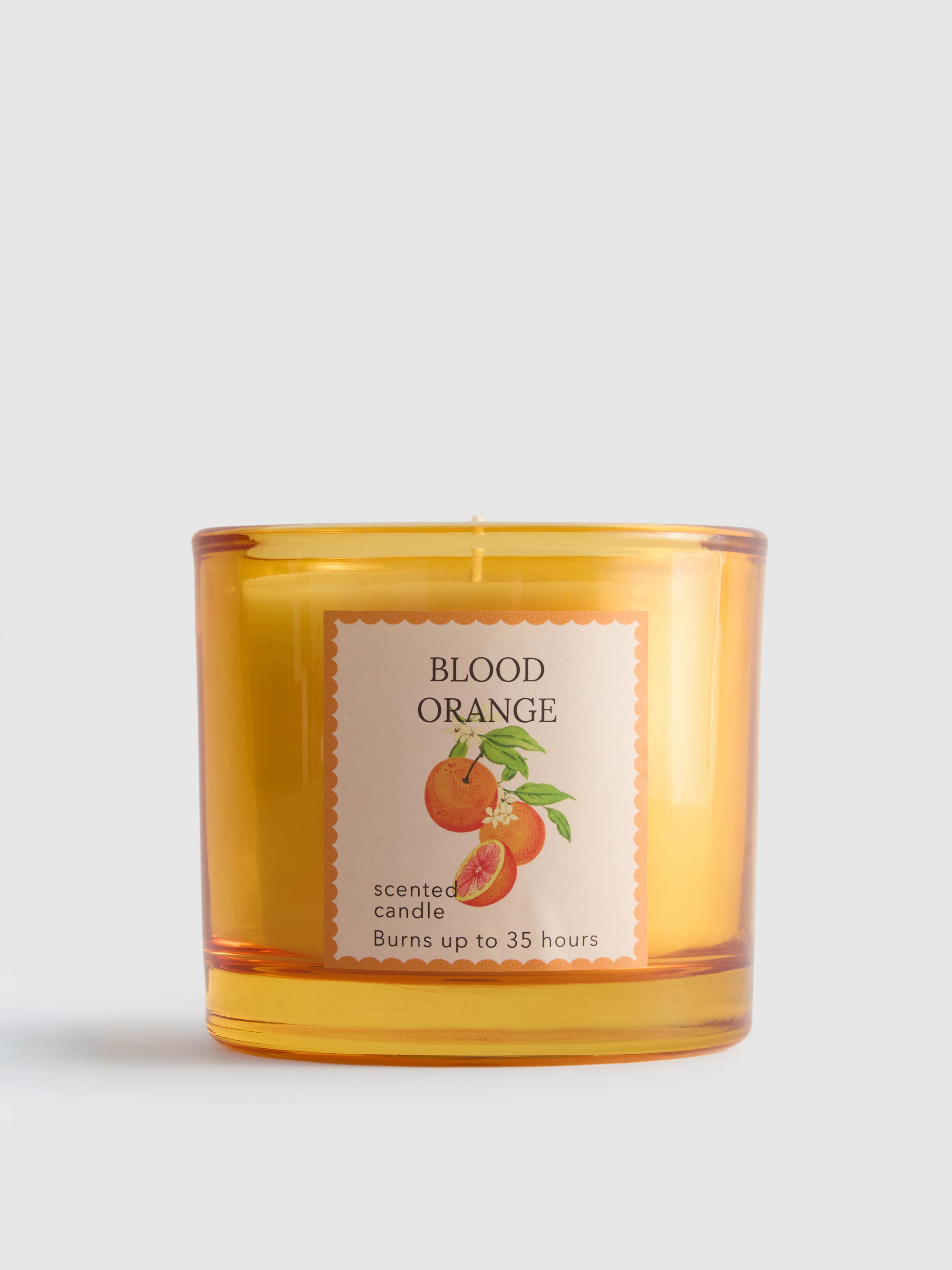 Geurkaars met fruitgeur in een glazen pot Oranje