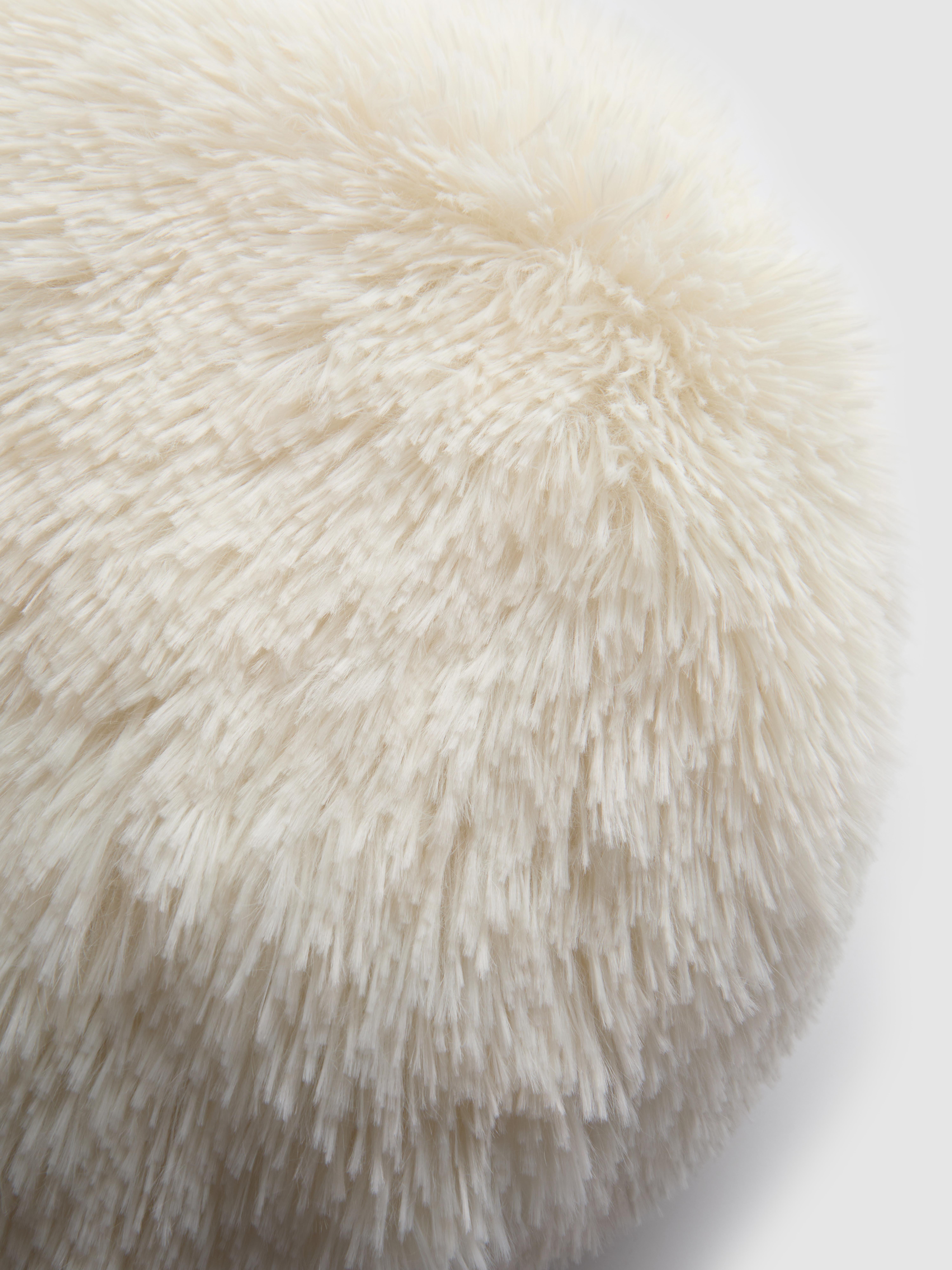 Coussin rond duveteux