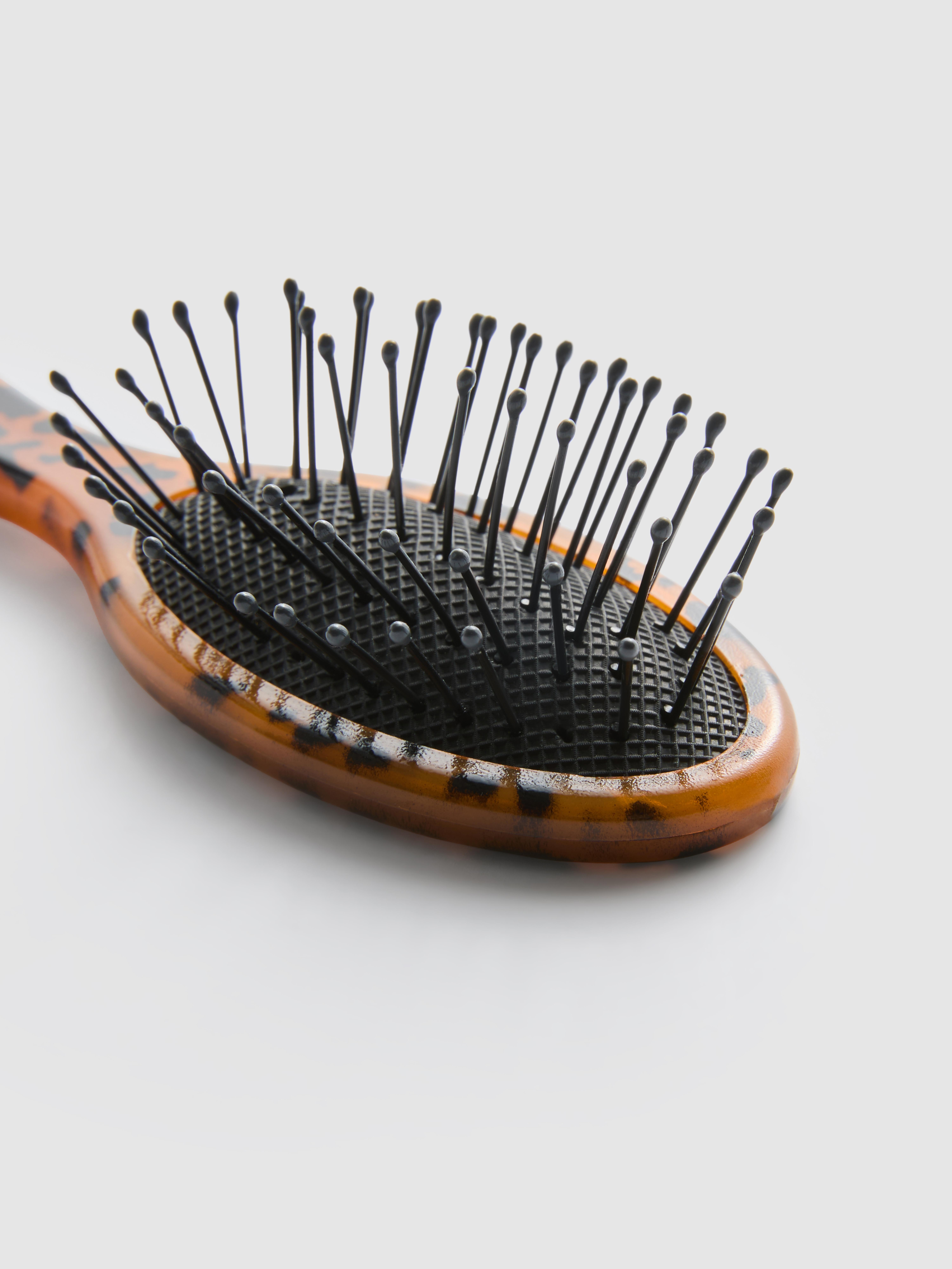 Malý cestovní pádlový kartáč se zvířecím potiskem