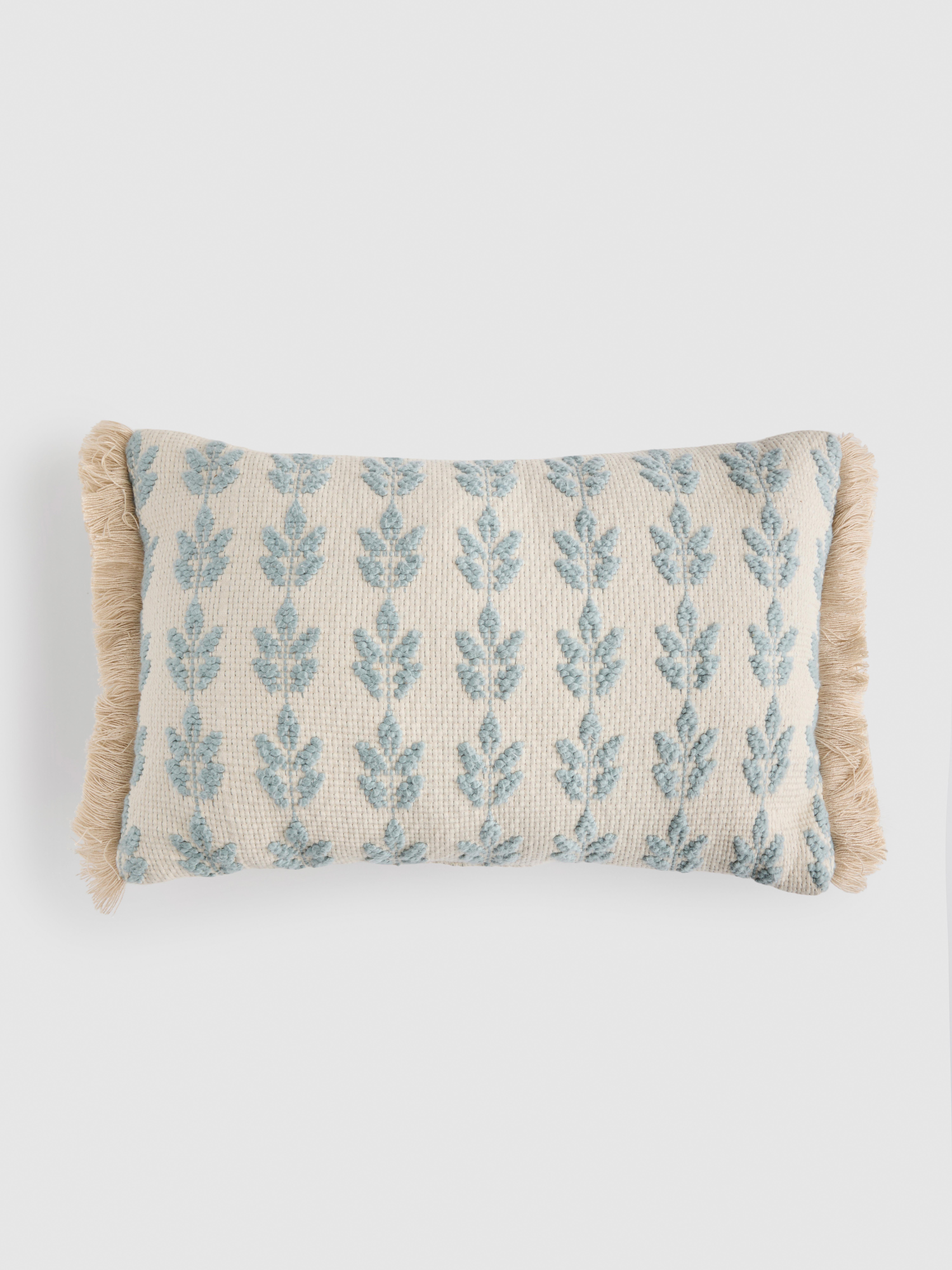 Cuscino taftato con frange