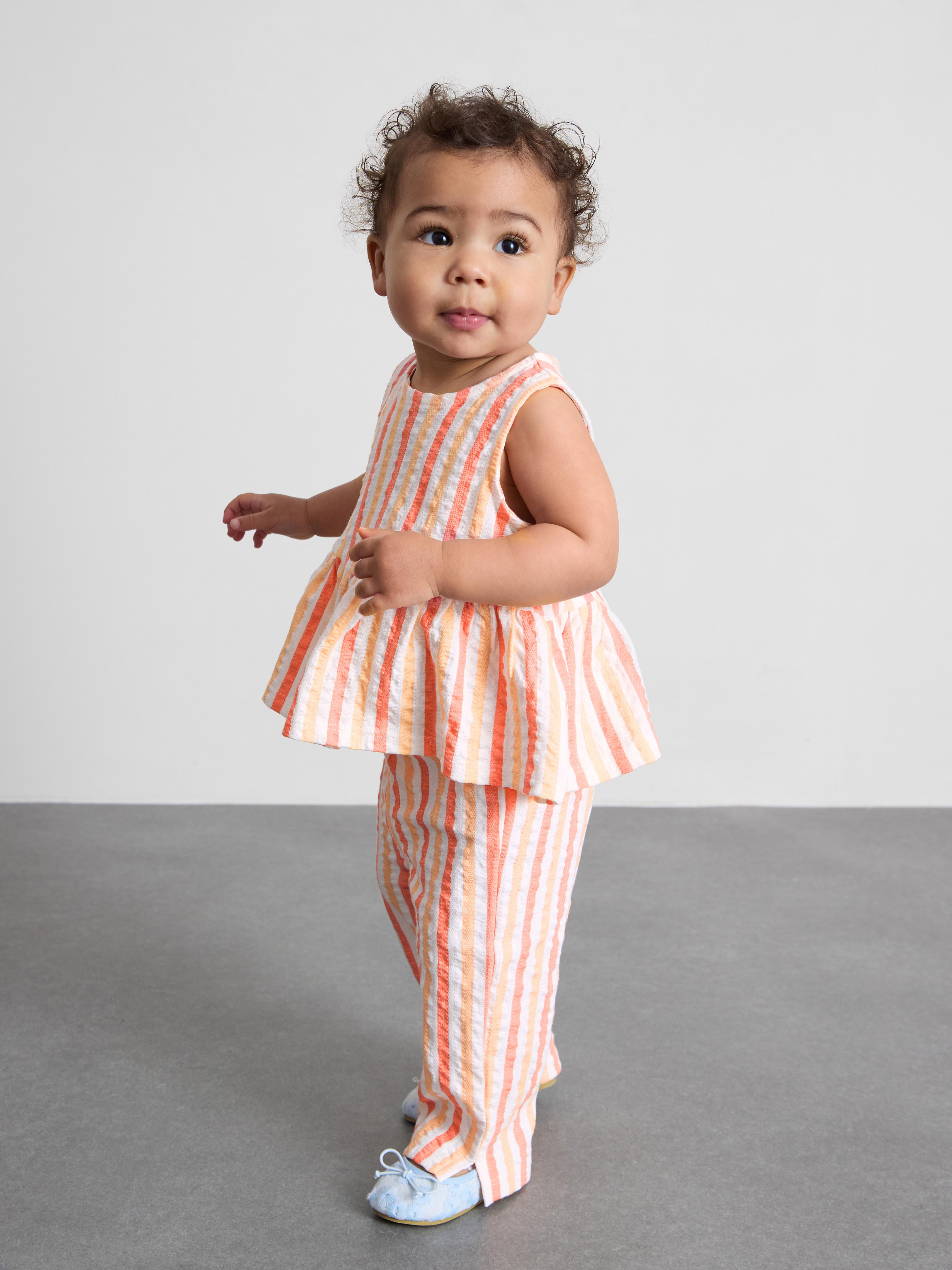 0-36 meses | Top con péplum y pantalones a rayas