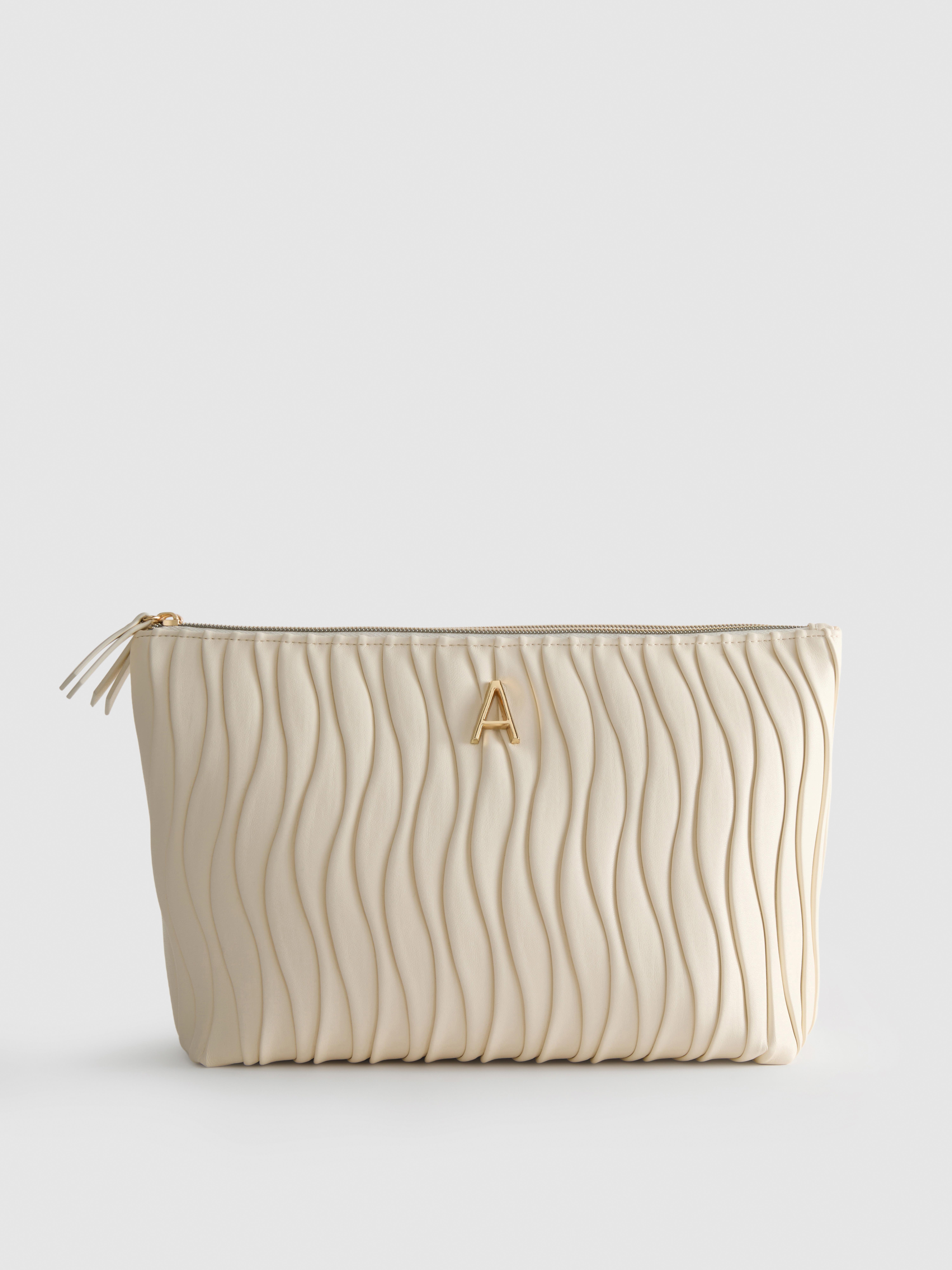 Kihajtató piperetáska rakott műbőr felülettel, monogrammal