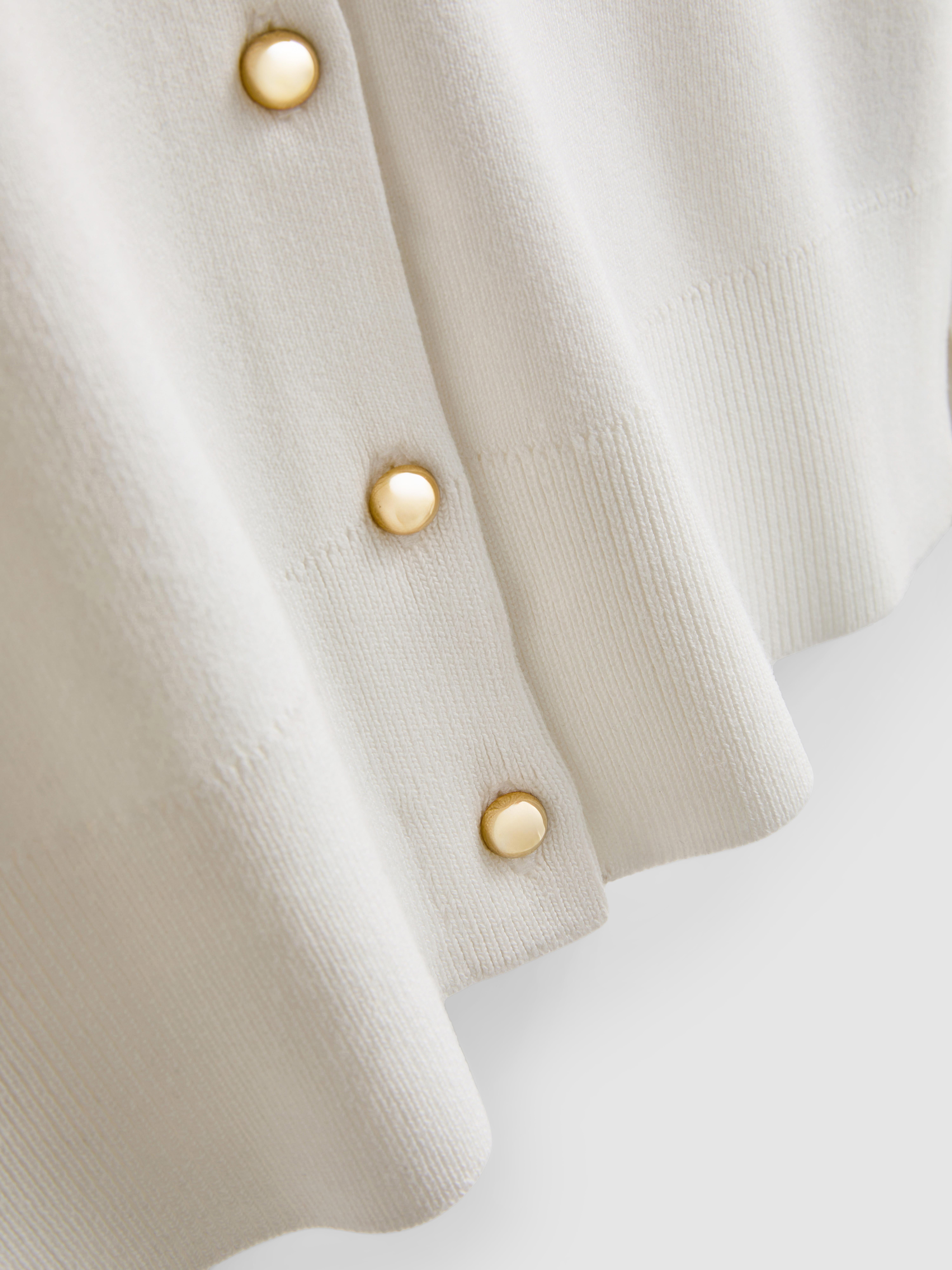Vest met metallic knopen