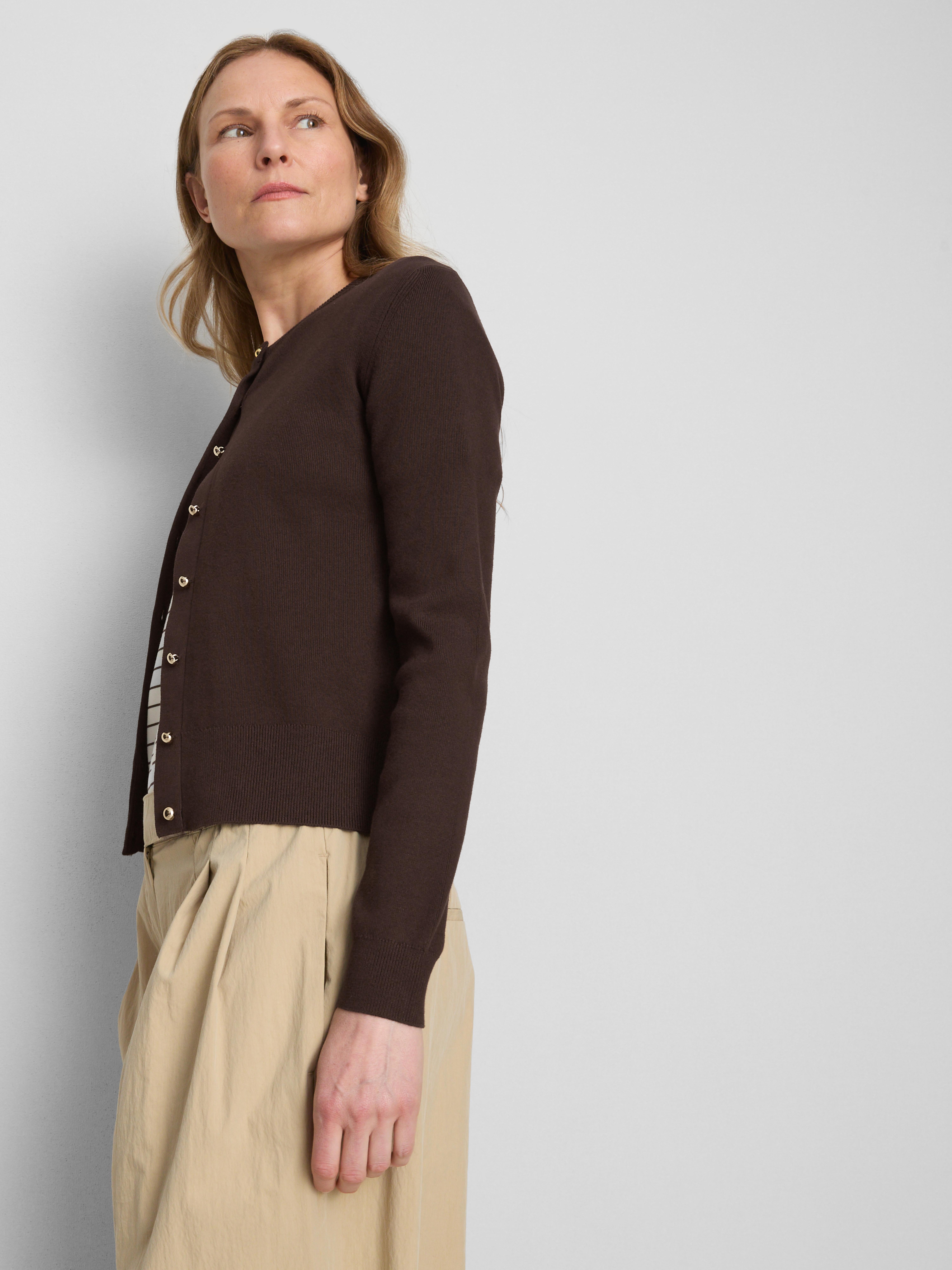 Vest met metallic knopen