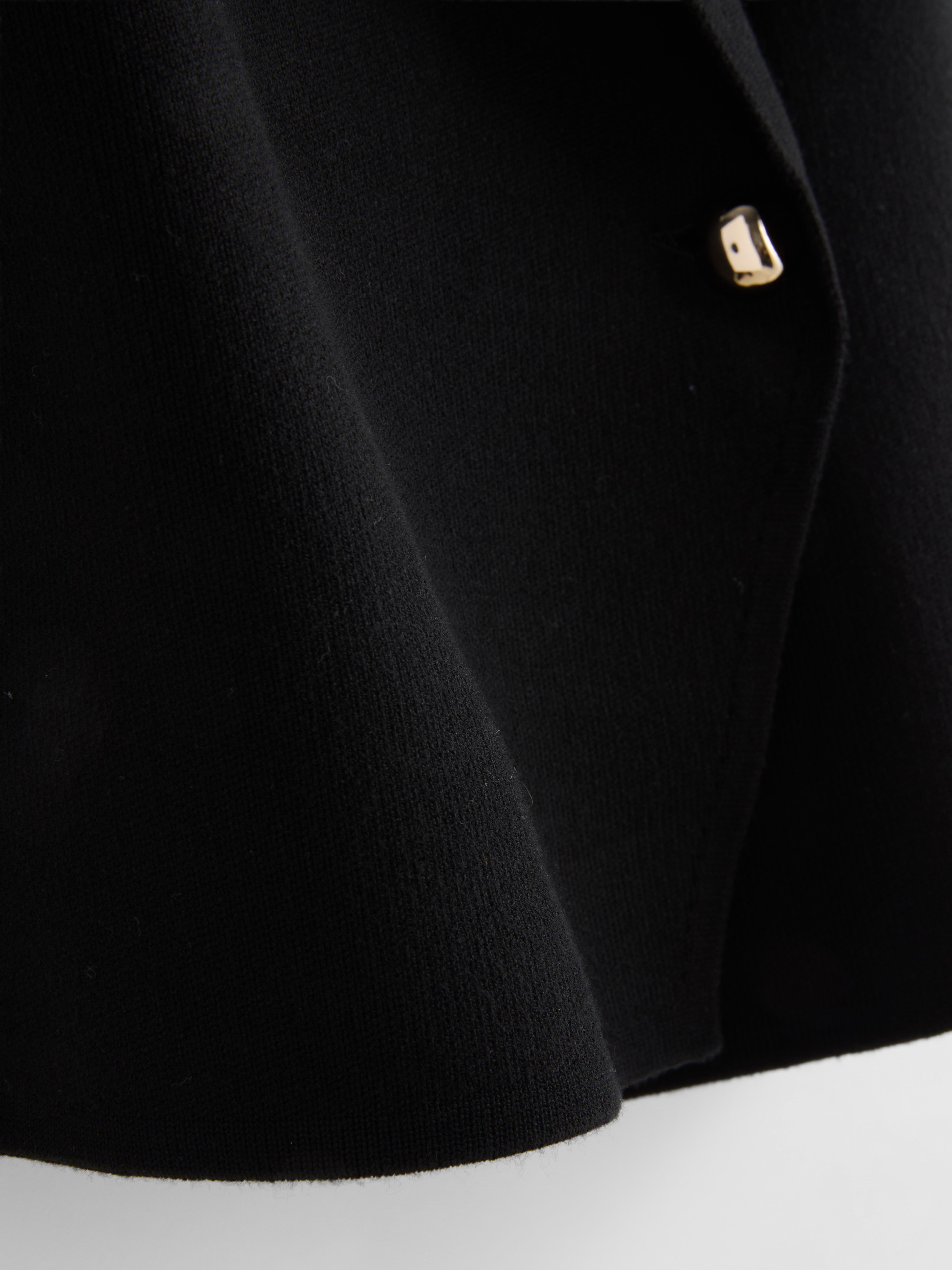 Chaleco asimétrico con cuello con solapas