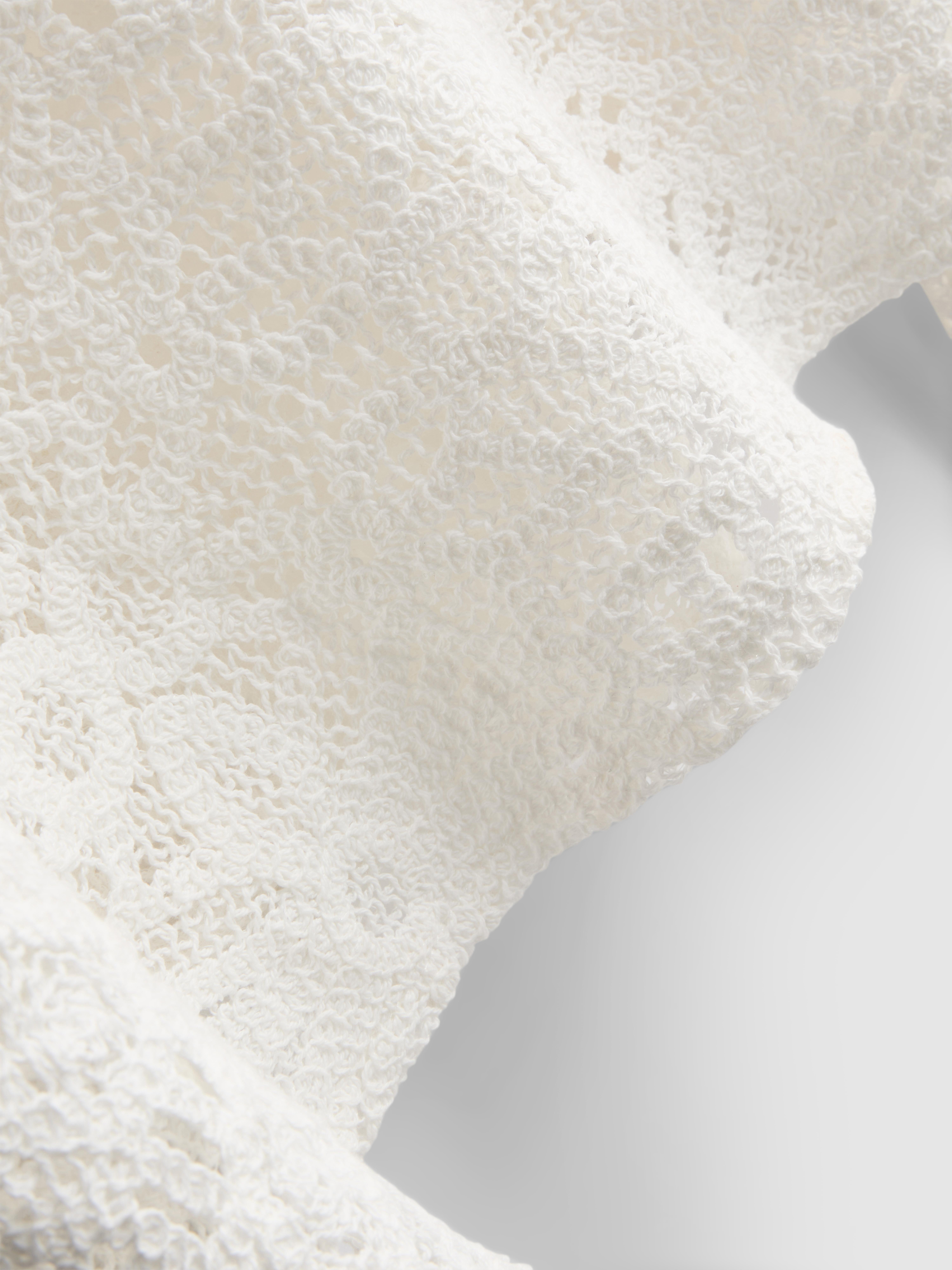 Bogaty w bawełnę szydełkowy top z długim rękawem