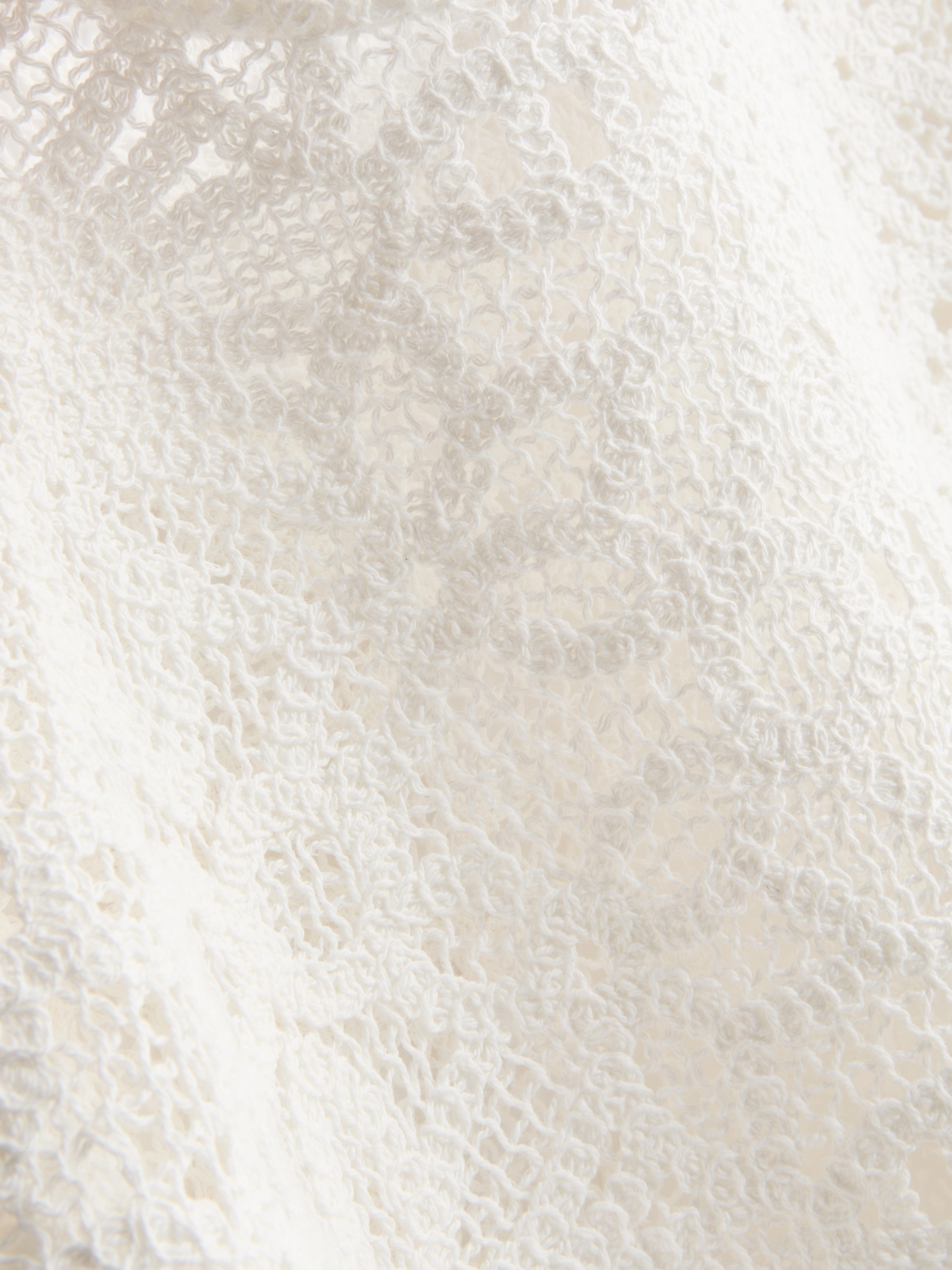 Bogaty w bawełnę szydełkowy top z długim rękawem