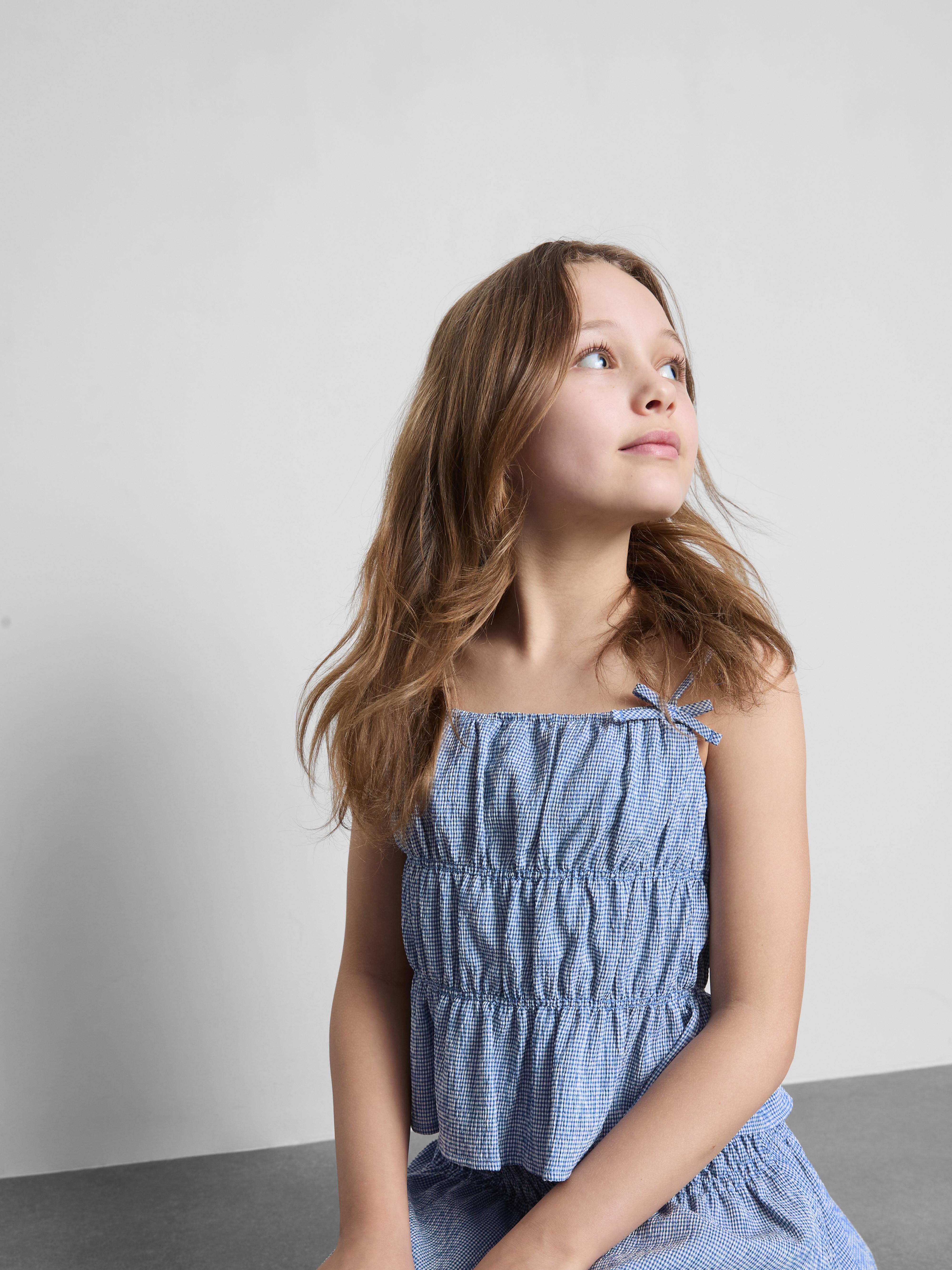 7-15 años | Blusa con vuelo