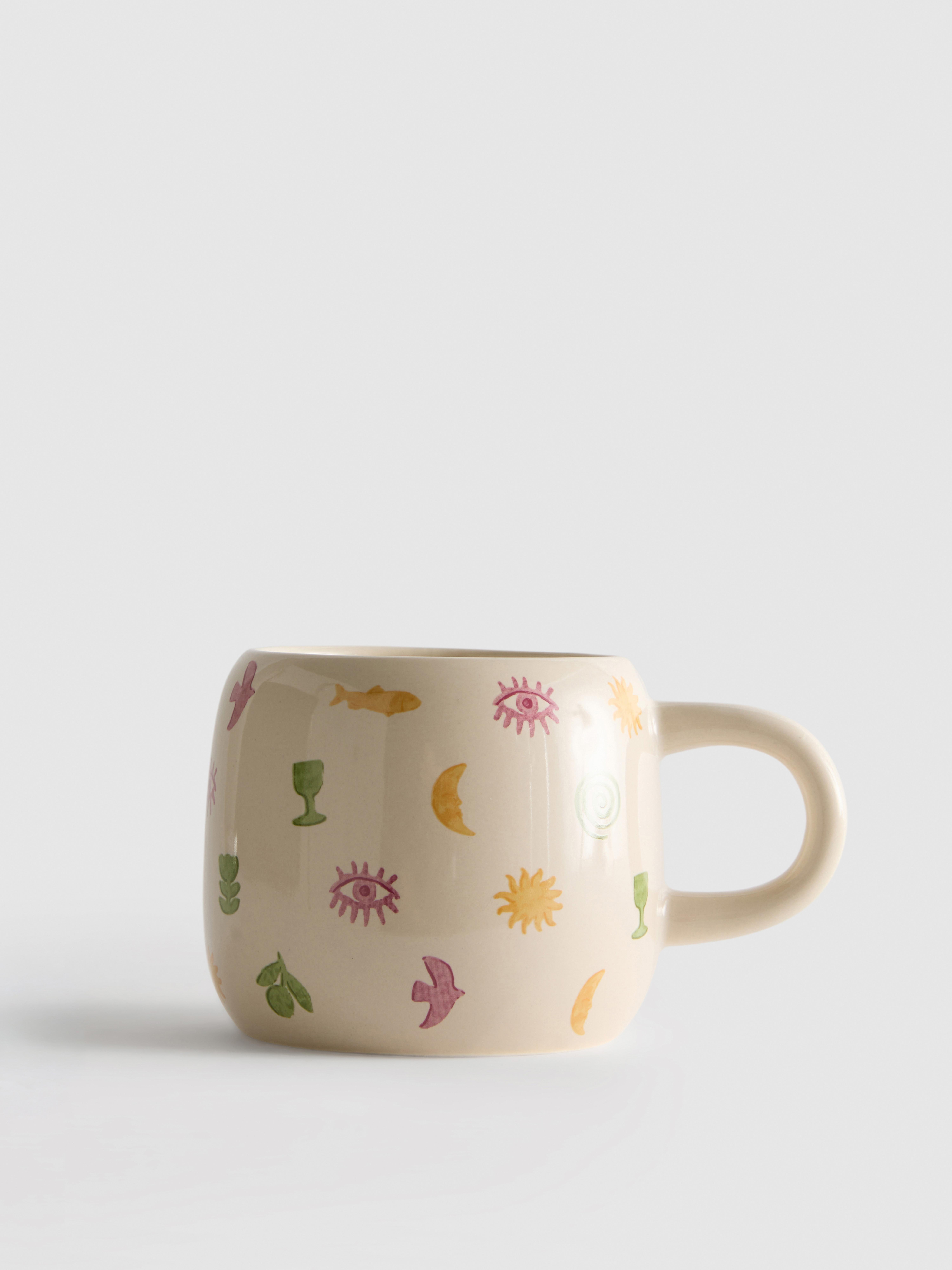 Taza con motivos celestiales