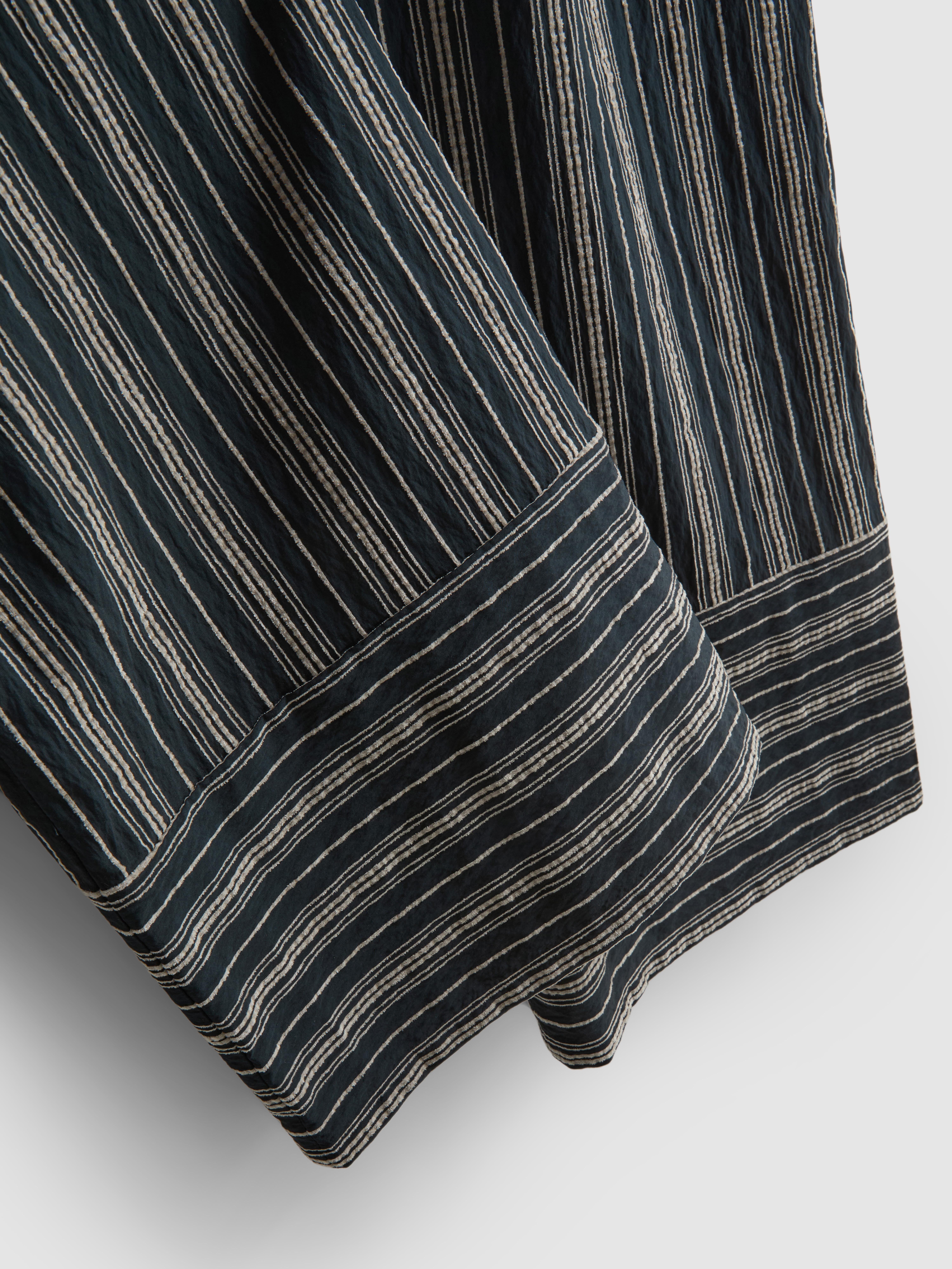 Pantalones de pernera ancha texturizados a rayas