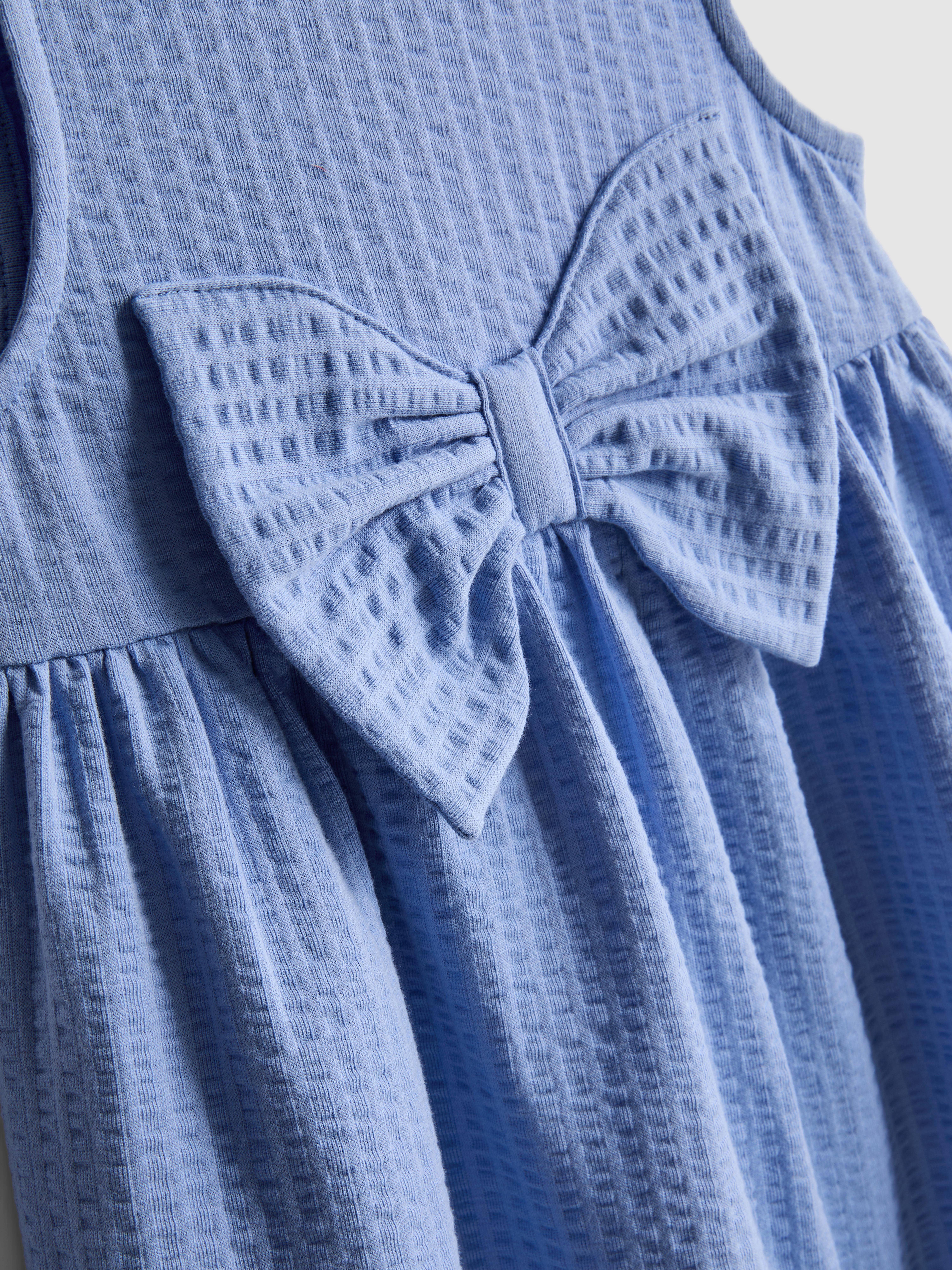 0-36 mnd | Jurk met textuur en strikdetail