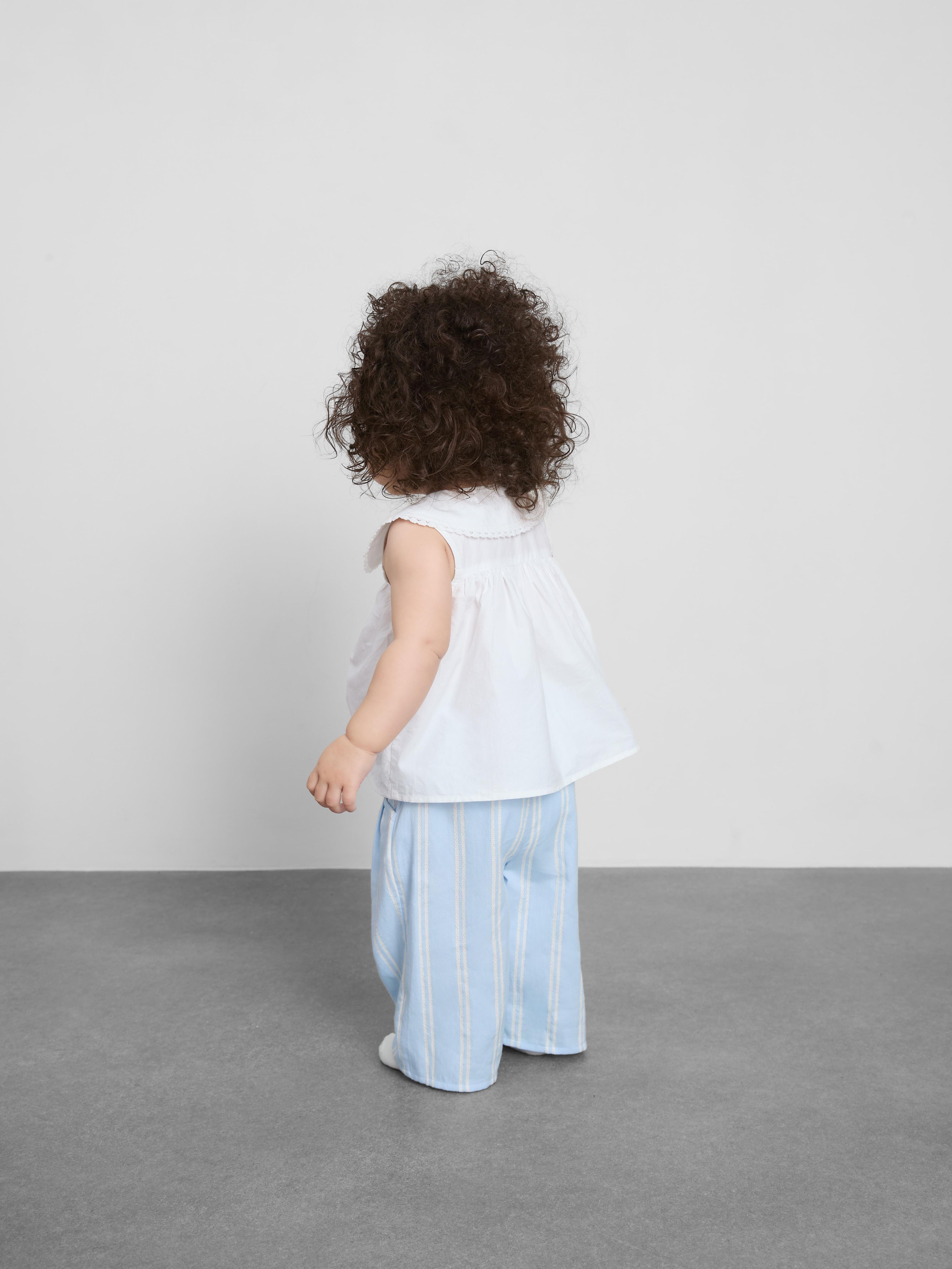 0–36 mes. | Bluza brez rokavov z ovratnikom in hlače