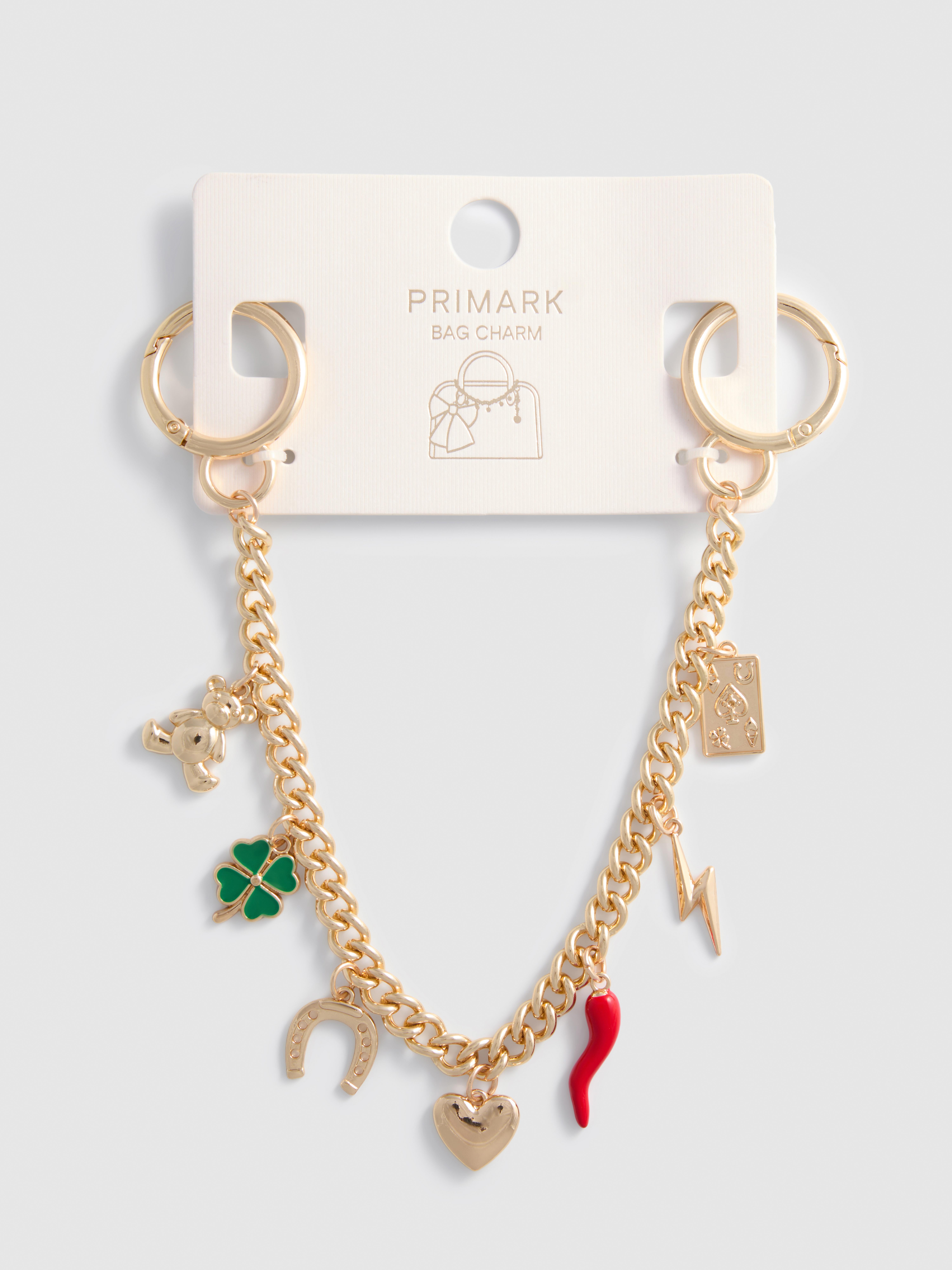 Tasketting met geluksbedeltjes