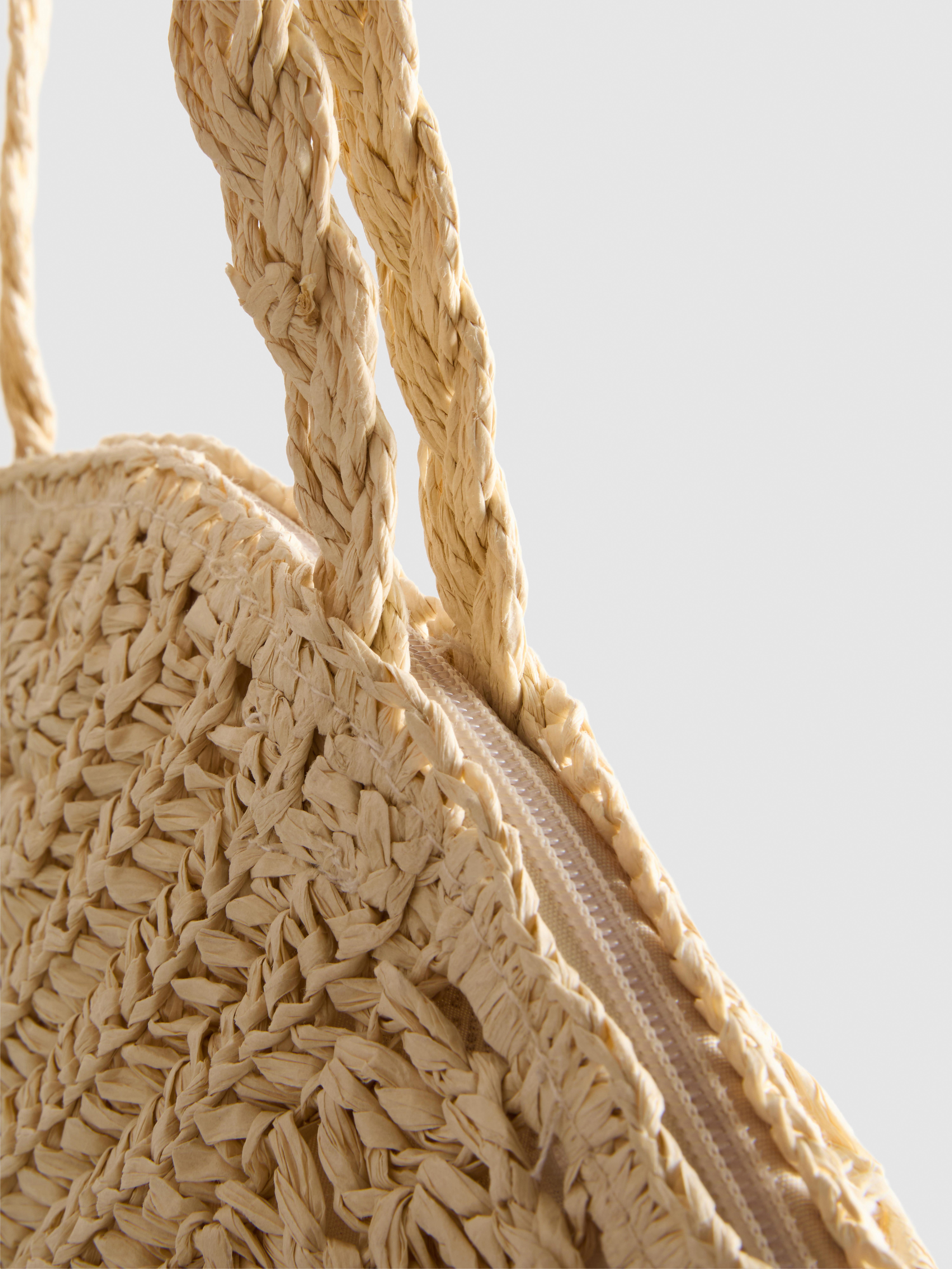 Borsa a spalla intrecciata a forma di conchiglia