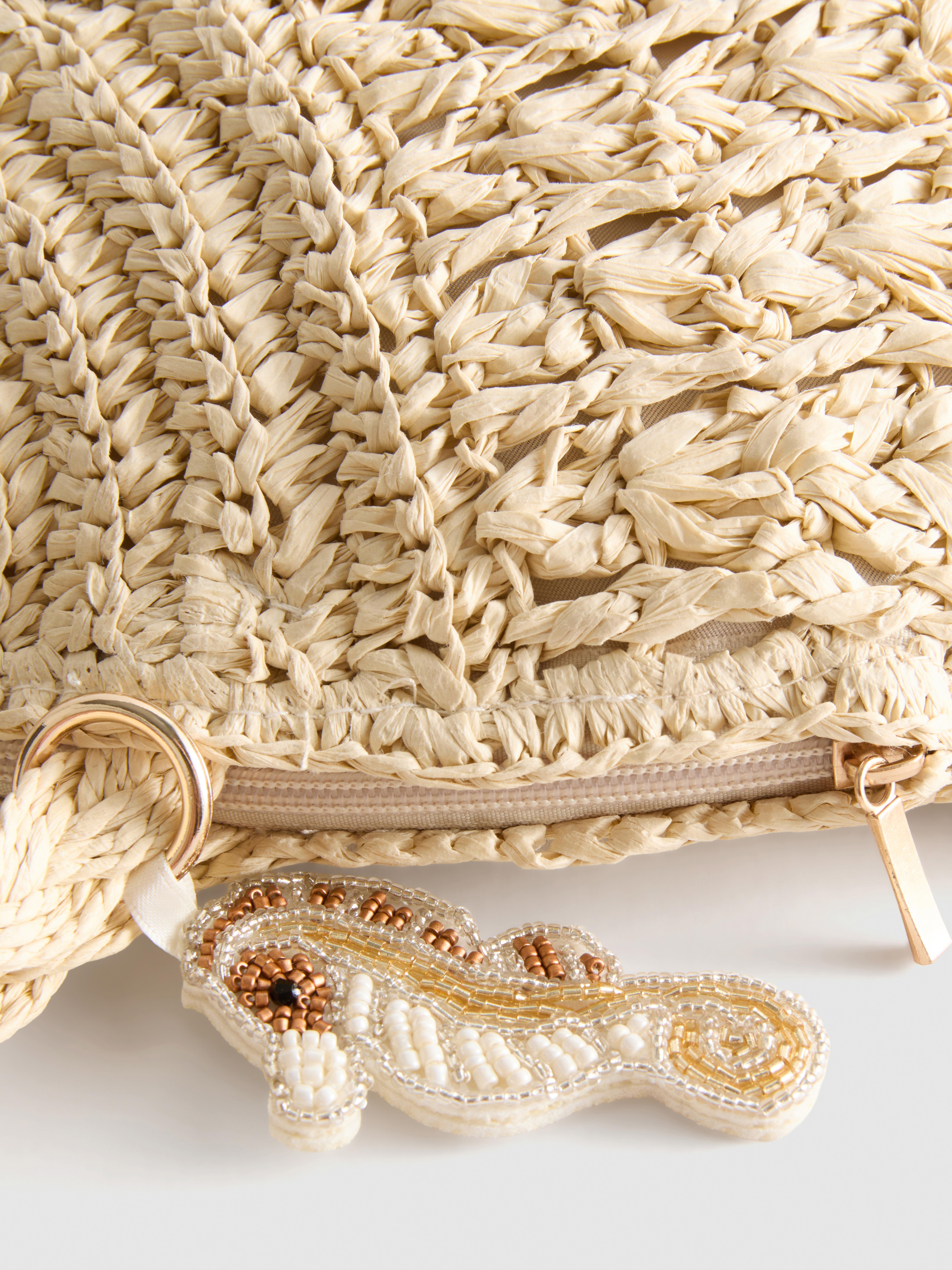 Borsa a spalla intrecciata a forma di conchiglia