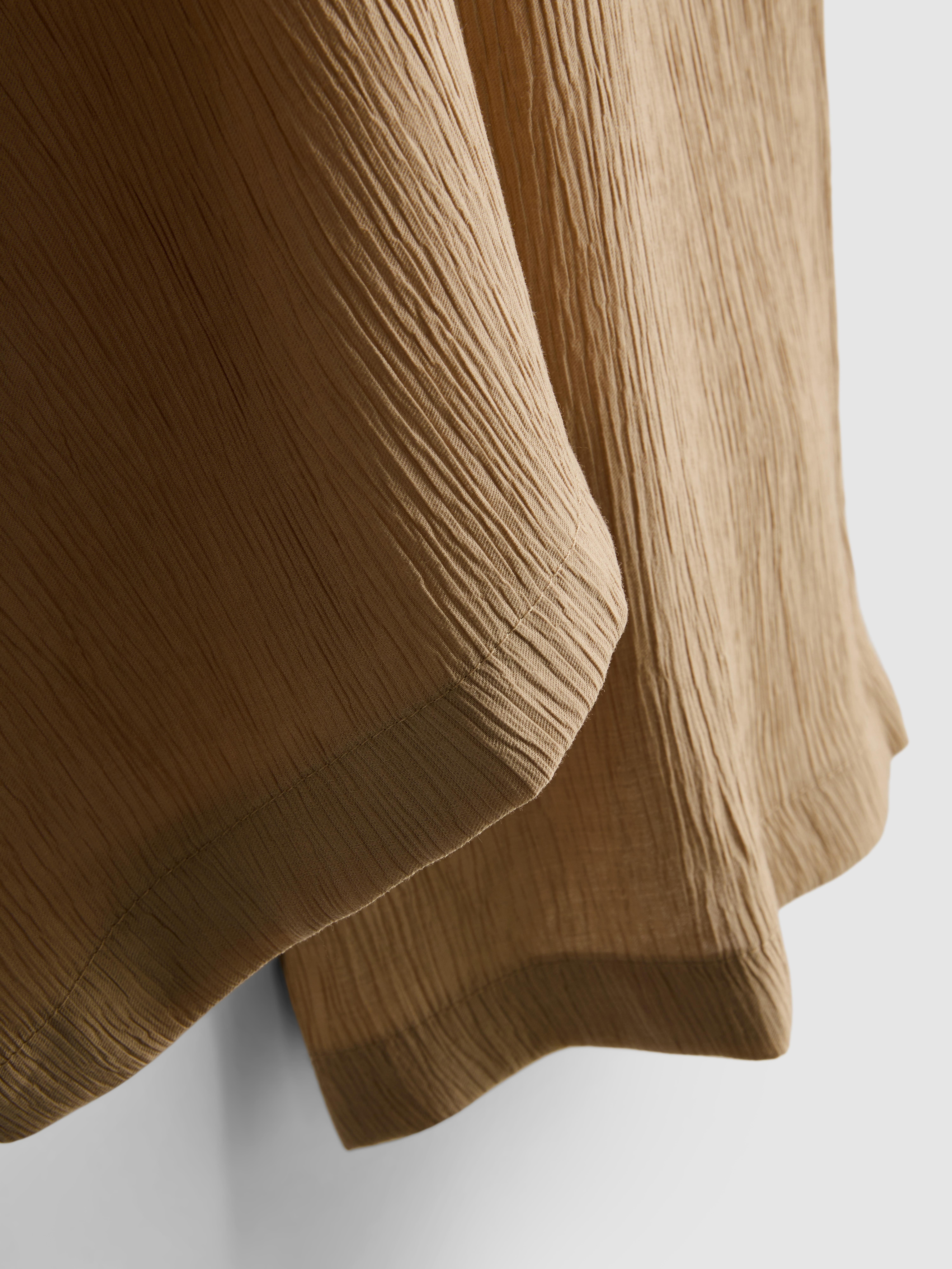 Pantaloni largi din material creponat
