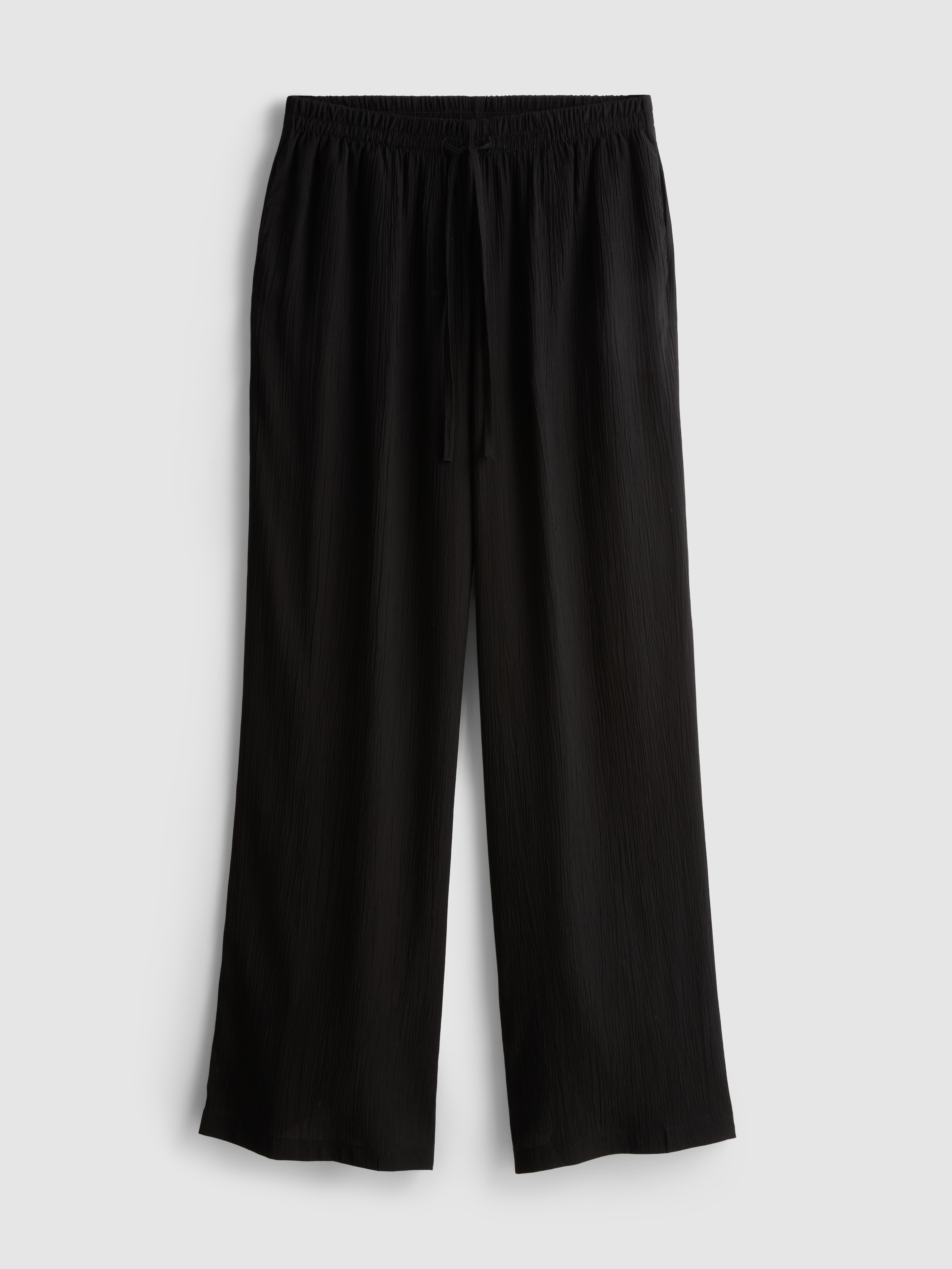 Pantaloni largi din material creponat