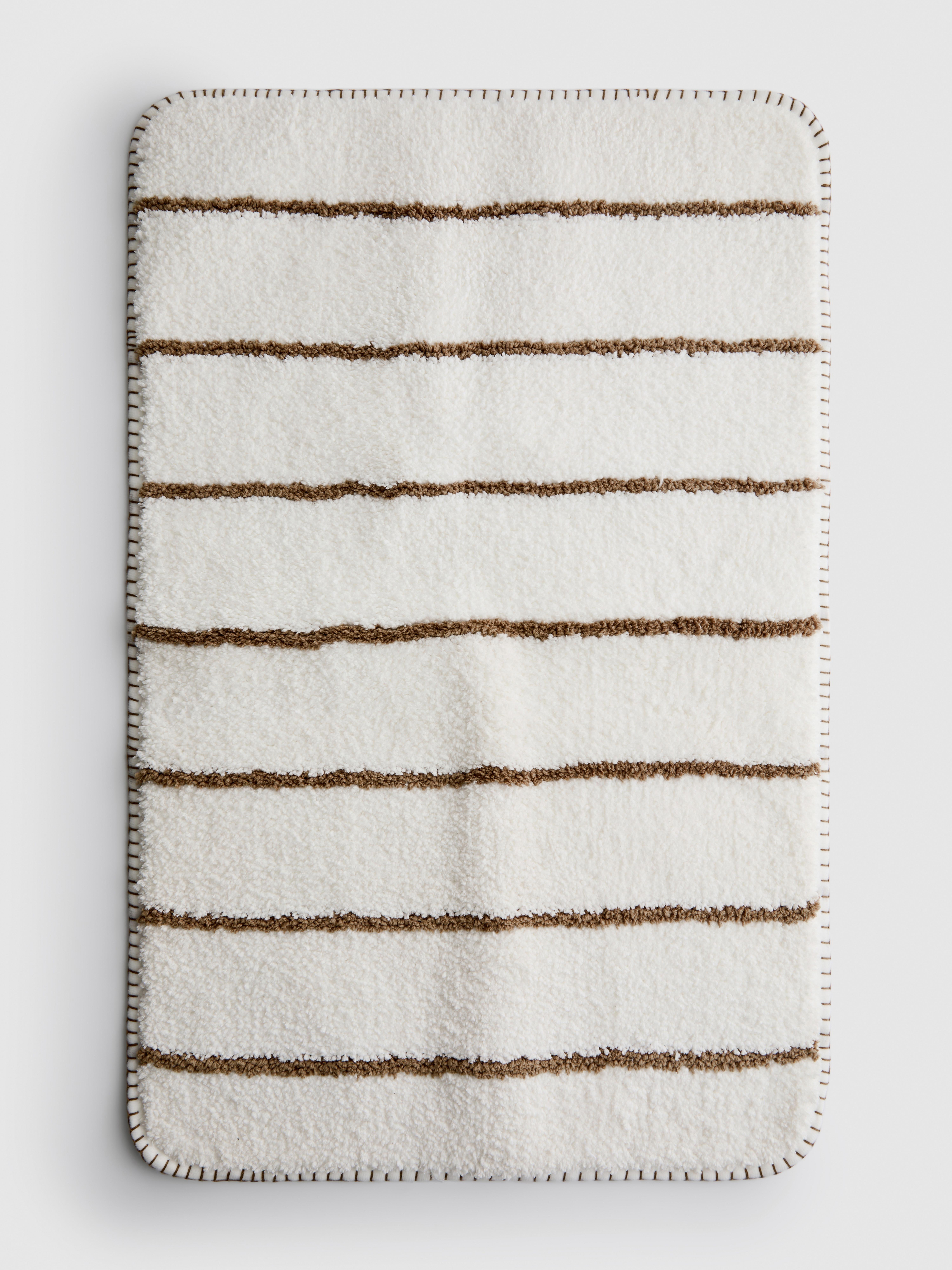 Tapis de bain tufté à rayures