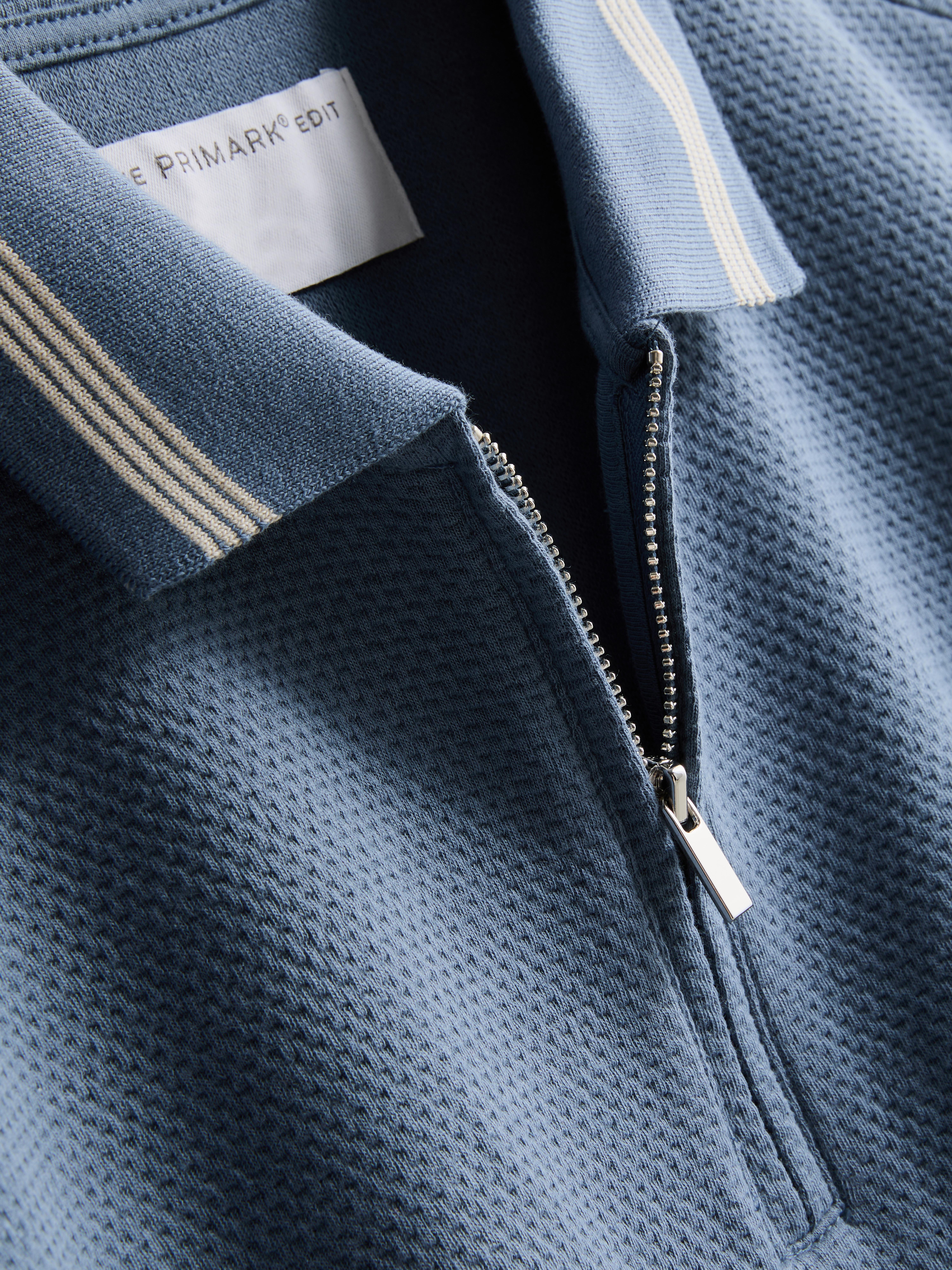 Poloshirt met textuur en rits