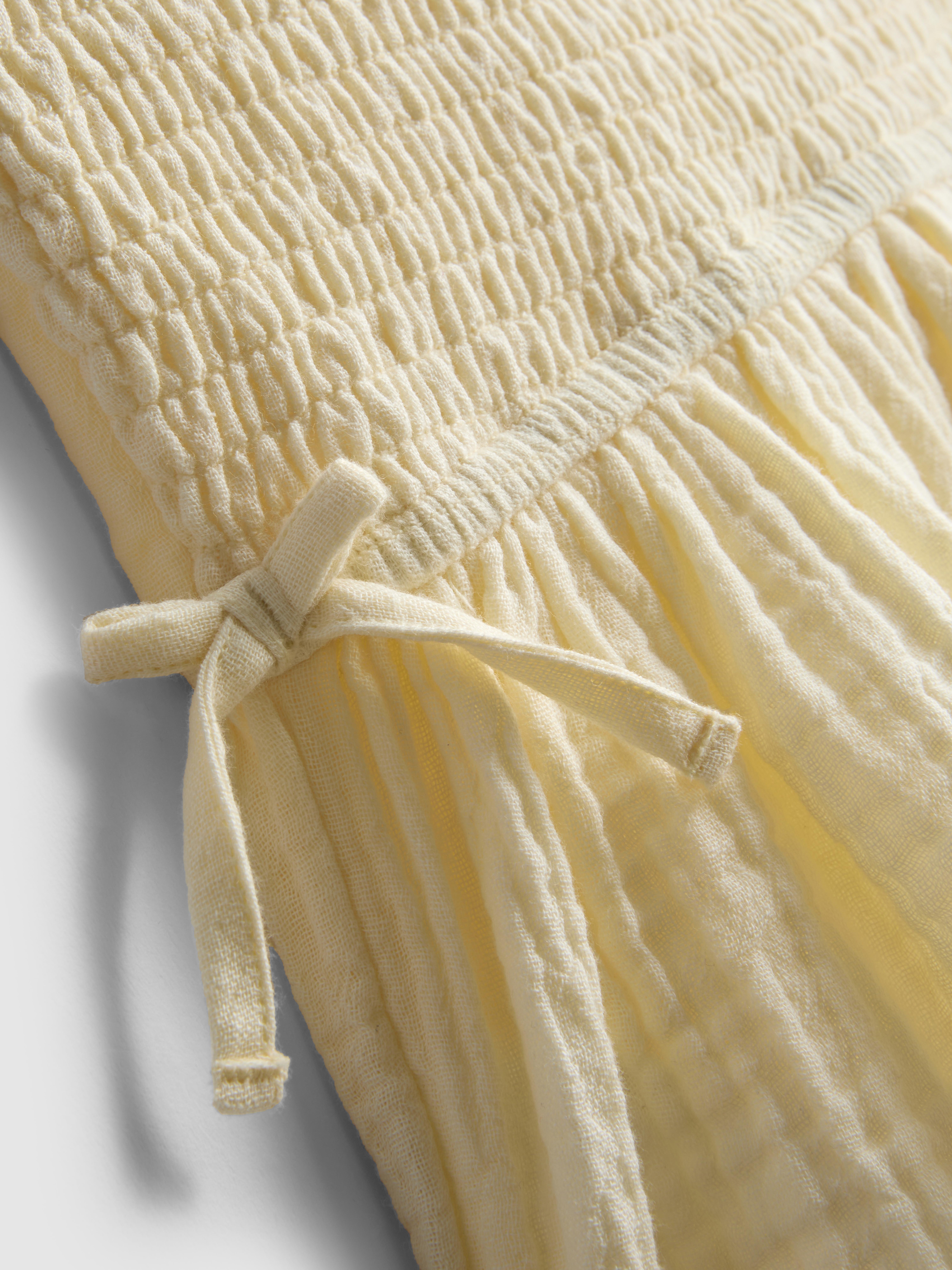 7-15 jr | Blouse met smokwerk en strikjes
